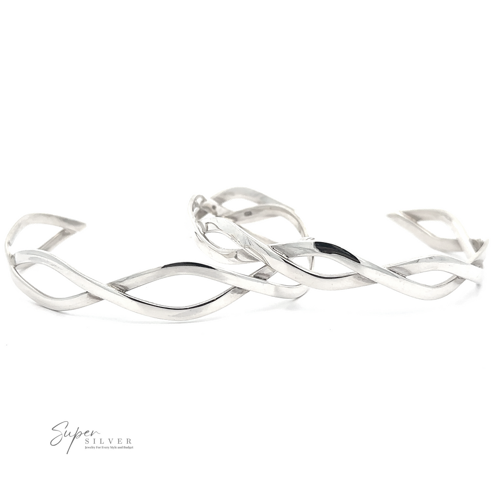Two intertwined Stylish Twisted Silver Cuffs with a twisting pattern are displayed. There's a 