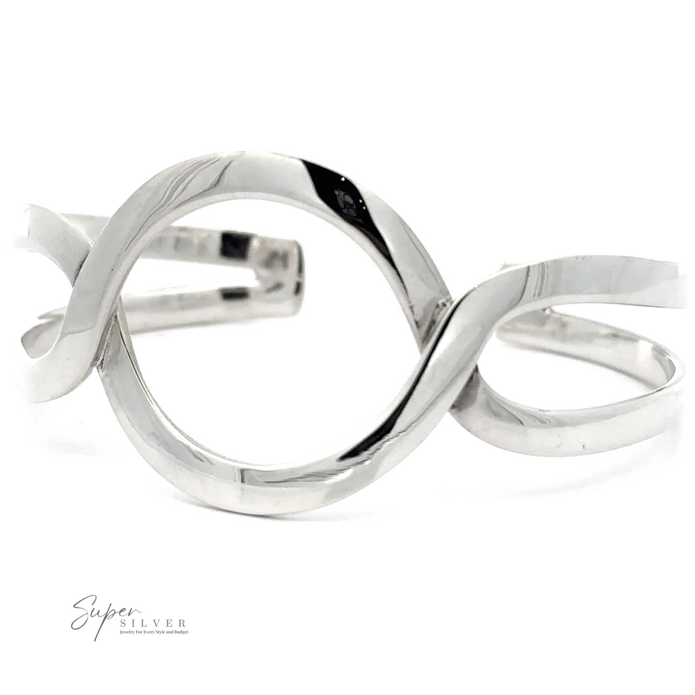 
                  
                    A Trendy Twisted Cuff with Circle Design in .925 Sterling Silver with an abstract, twisted loop design is displayed against a white background, showcasing its boho chic appeal.
                  
                