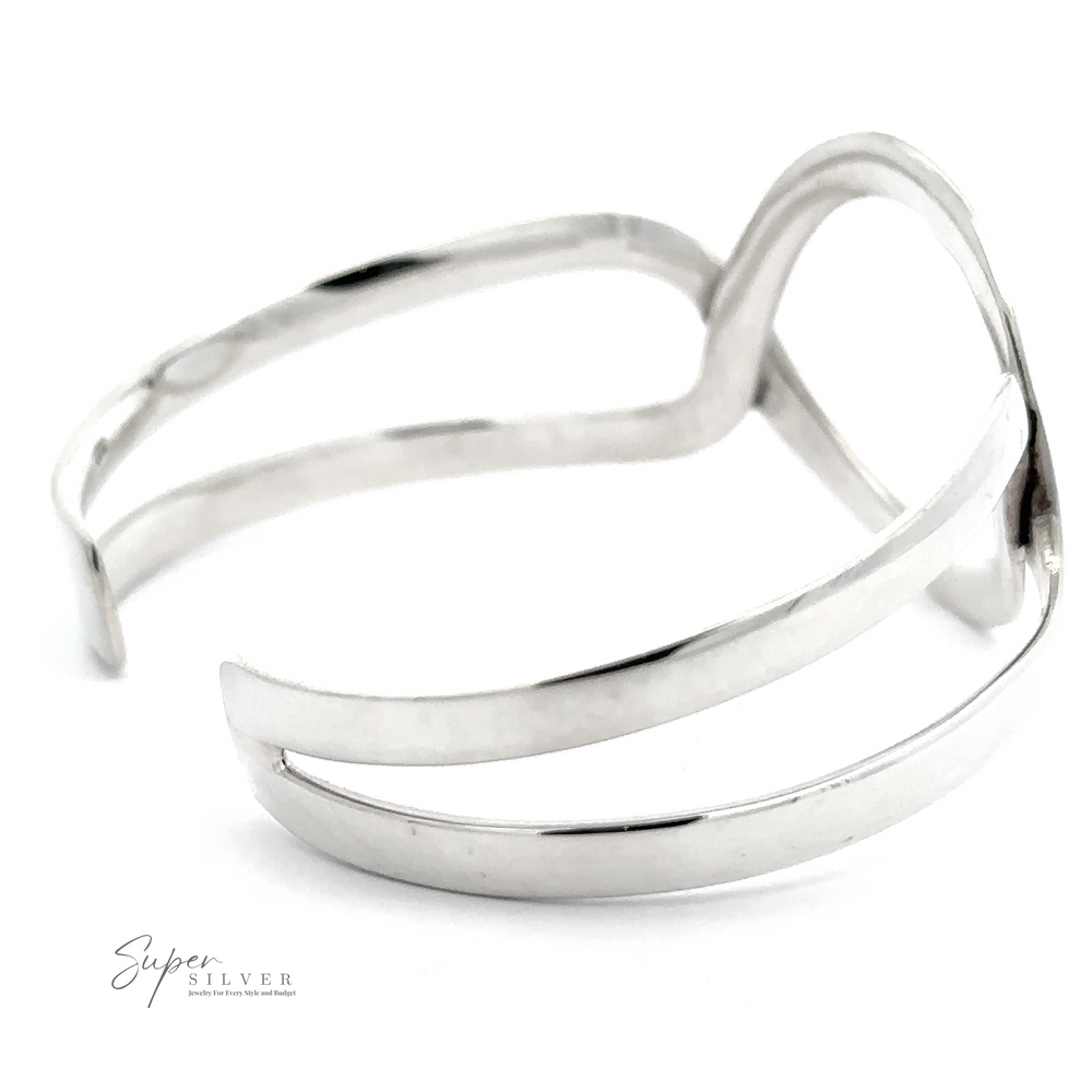 
                  
                    A sleek, silver cuff bracelet with an open wave design, featuring a polished finish. Made from .925 Sterling Silver, the **Trendy Twisted Cuff with Circle Design** bears the "Super Silver" logo in the corner.
                  
                