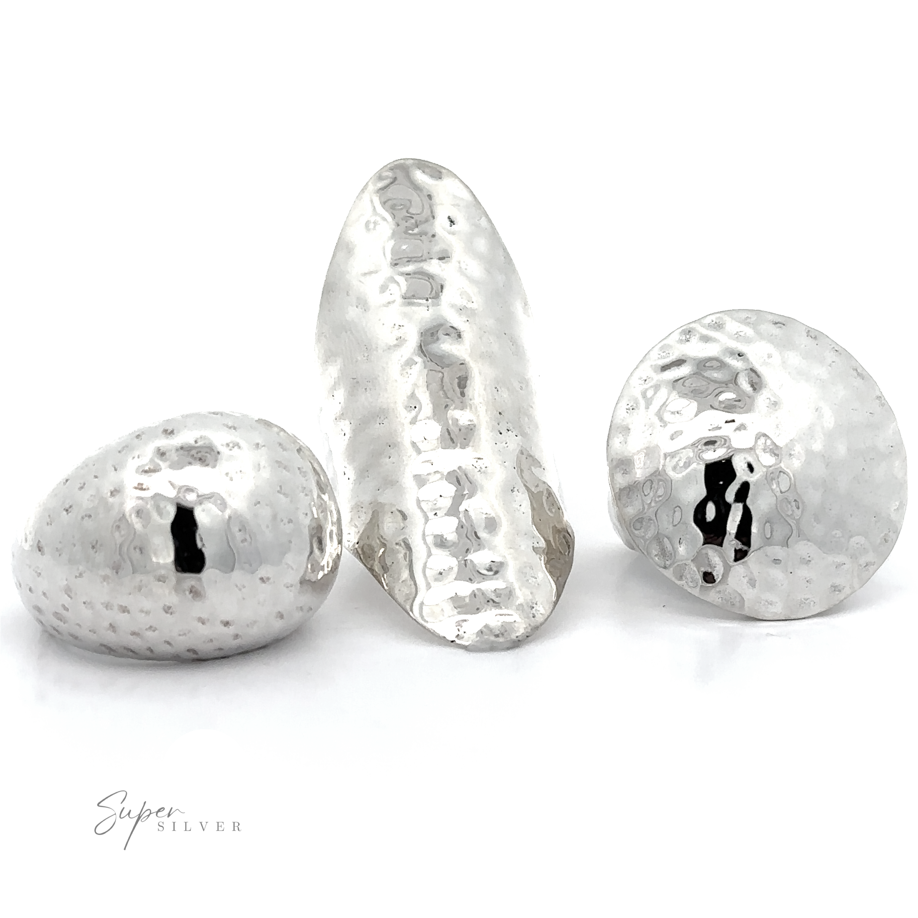 Three Statement Hammered Rings with silver hammered balls on a white background, exuding boldness.