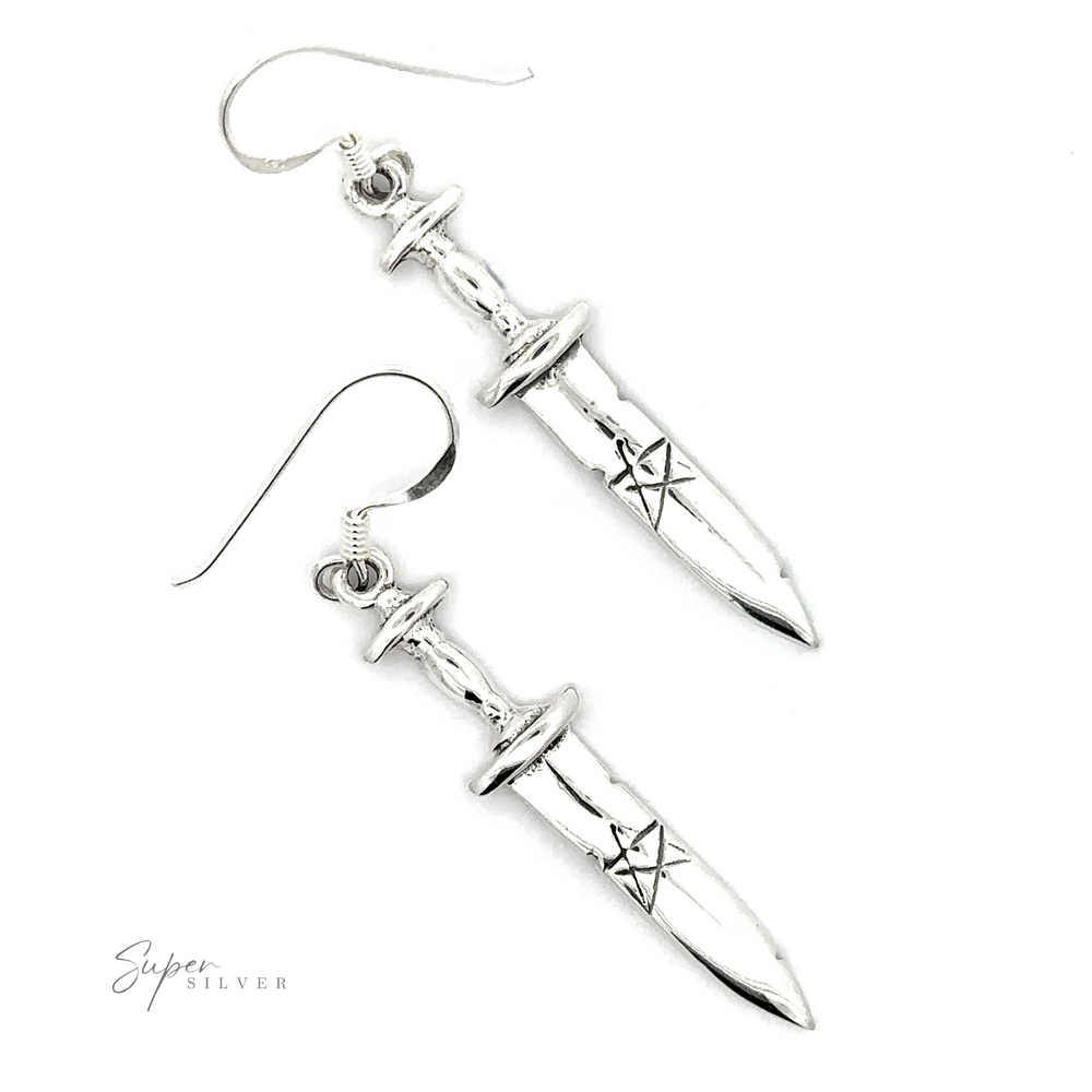 A pair of Dagger Earrings With Pentagram, exuding a gothic style, displayed on a white background.