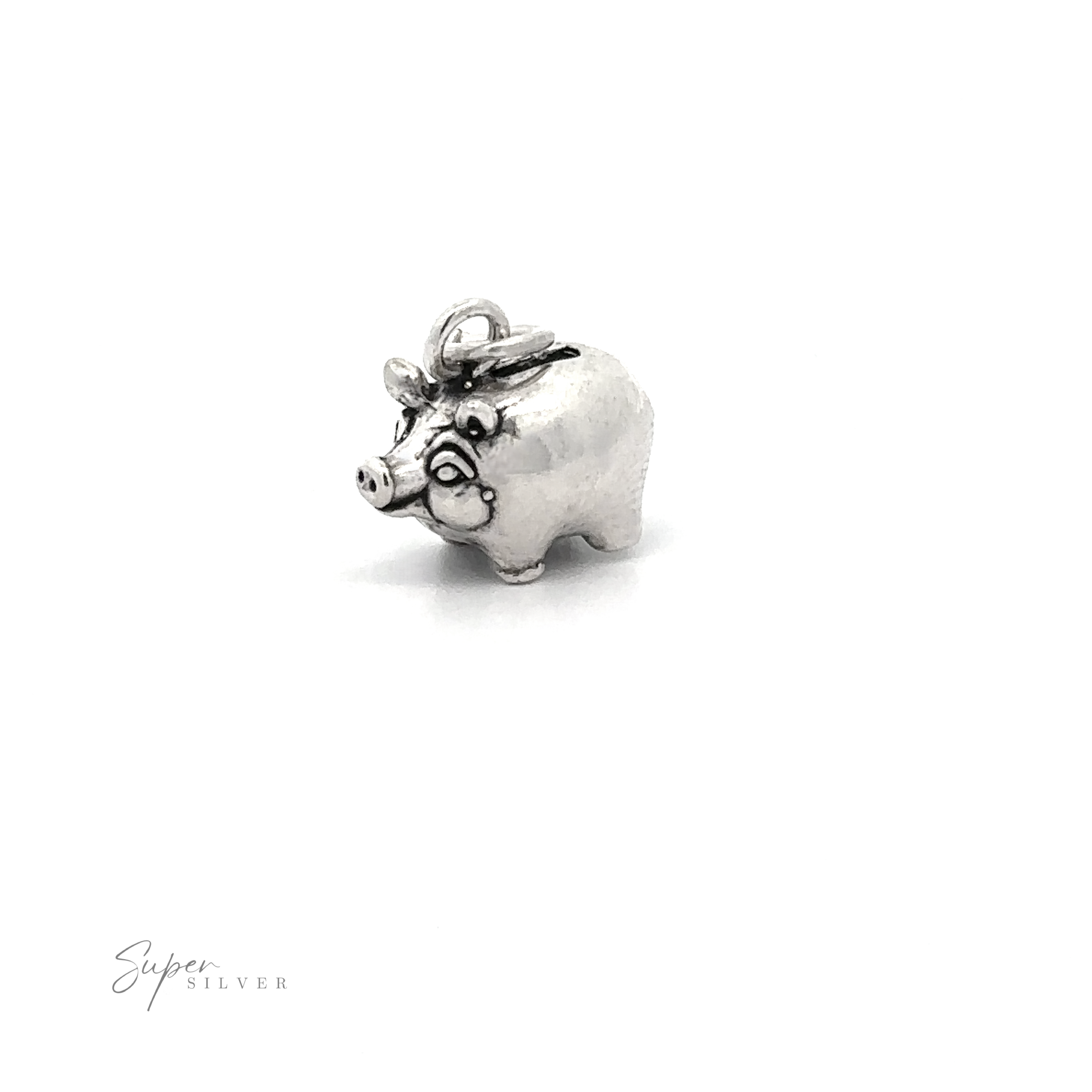 Introducing the Piggy Bank Charm: a small, playful .925 Sterling Silver pig charm with a loop on top, perfect for attaching to either a bracelet or necklace. This charm showcases intricate facial expressions and a curly tail. "Super Silver" is inscribed in the corner for added authenticity.
