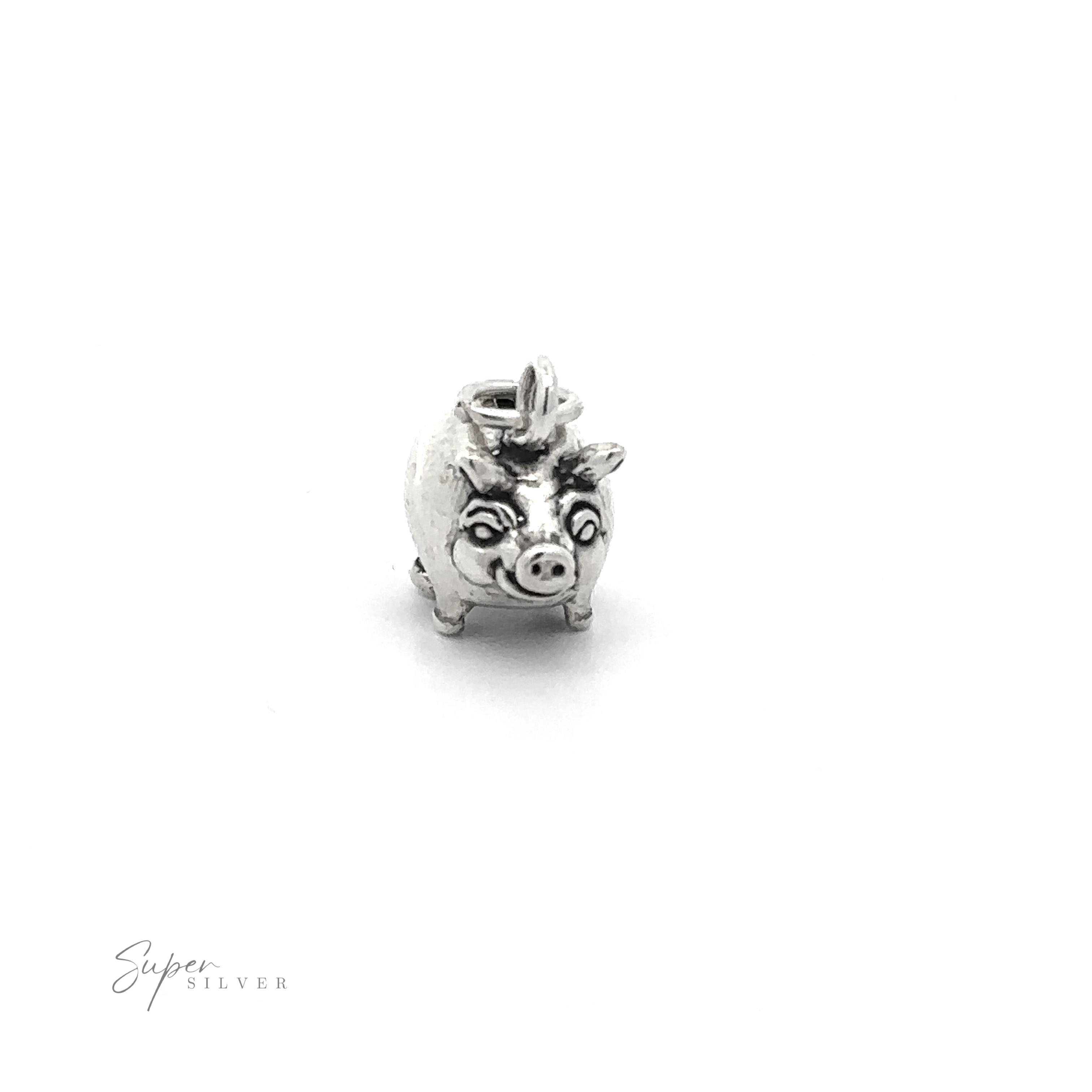 The Piggy Bank Charm is a small, silver pig-shaped piece with detailed features, including eyes and ears. Made from .925 Sterling Silver, this playful jewelry item has an attachment loop on top and the brand name "Super Silver" visible in the bottom left corner.