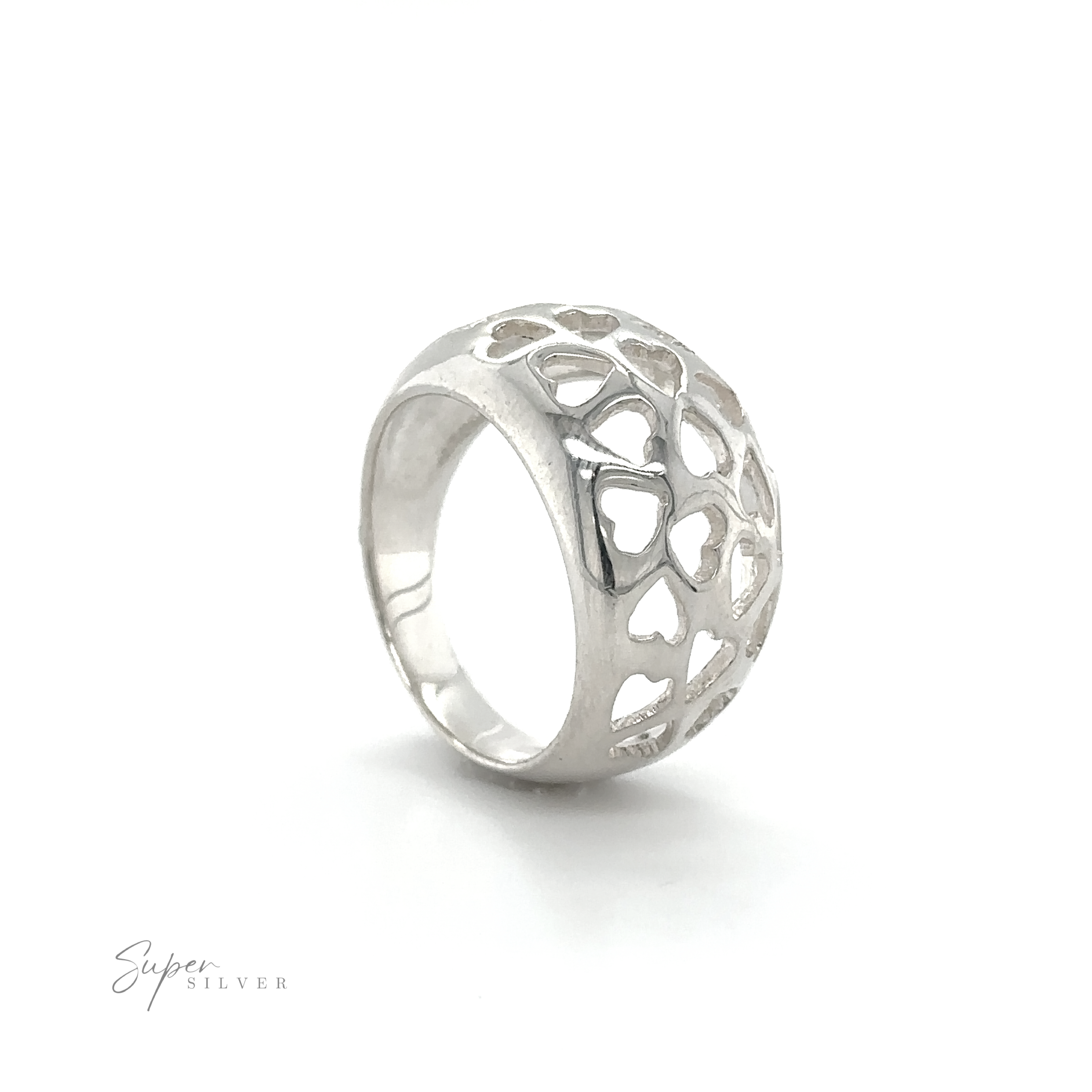 A minimalist Domed Ring Cut-Out Hearts with an intricate heart design.