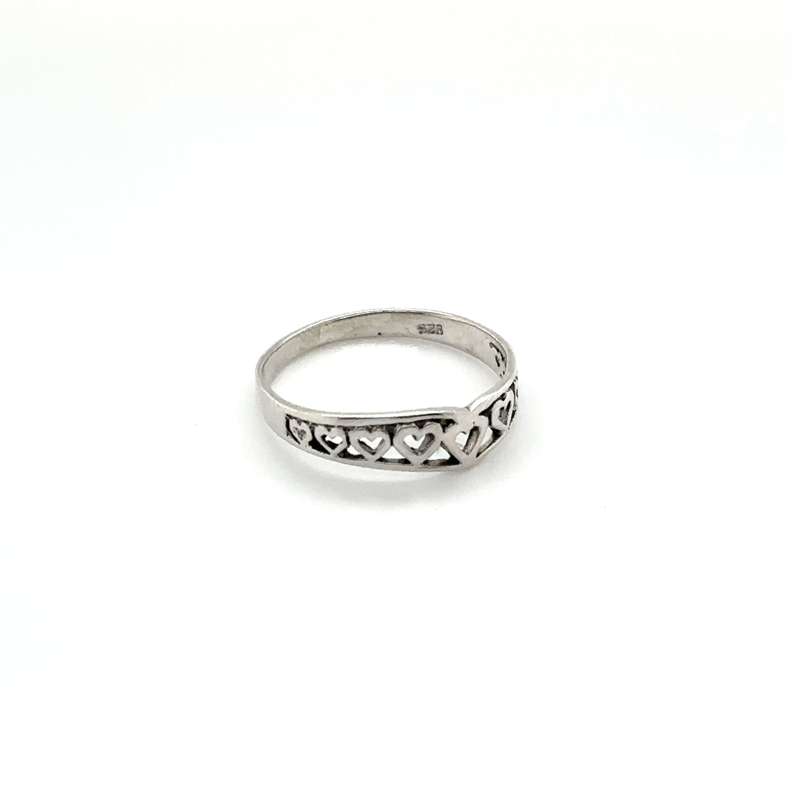A Chevron Shaped Ring Lined with Hearts, perfect for expressing love or as an engagement ring.