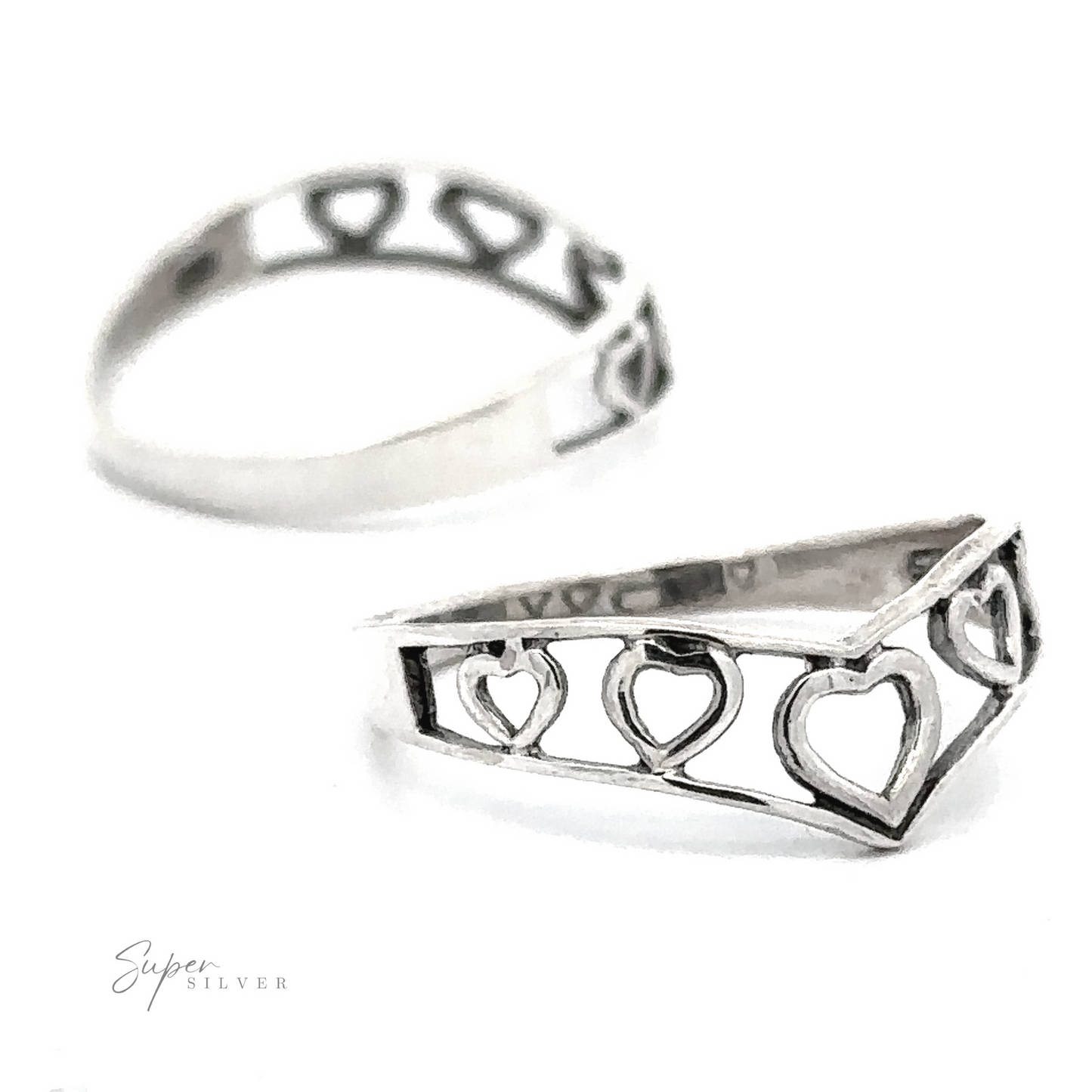 Chevron Shaped Open Heart Band featuring a row of heart cut-outs, displayed against a white background with a blurred "super silver" signature at the bottom.