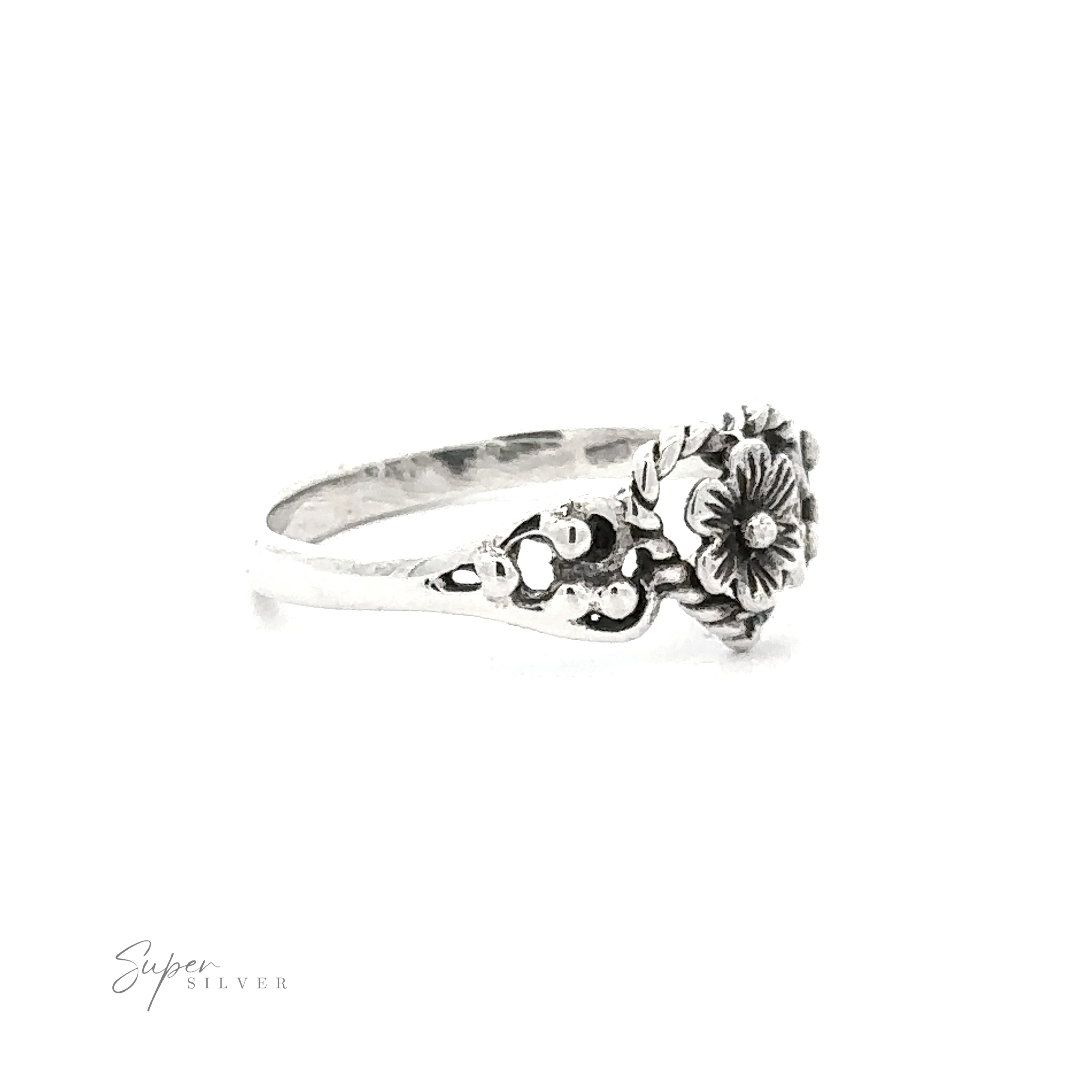 Twisted Heart Outline Ring with Floral Detailing featuring detailed blooms and leaves, with a signature in the bottom right corner on a white background.