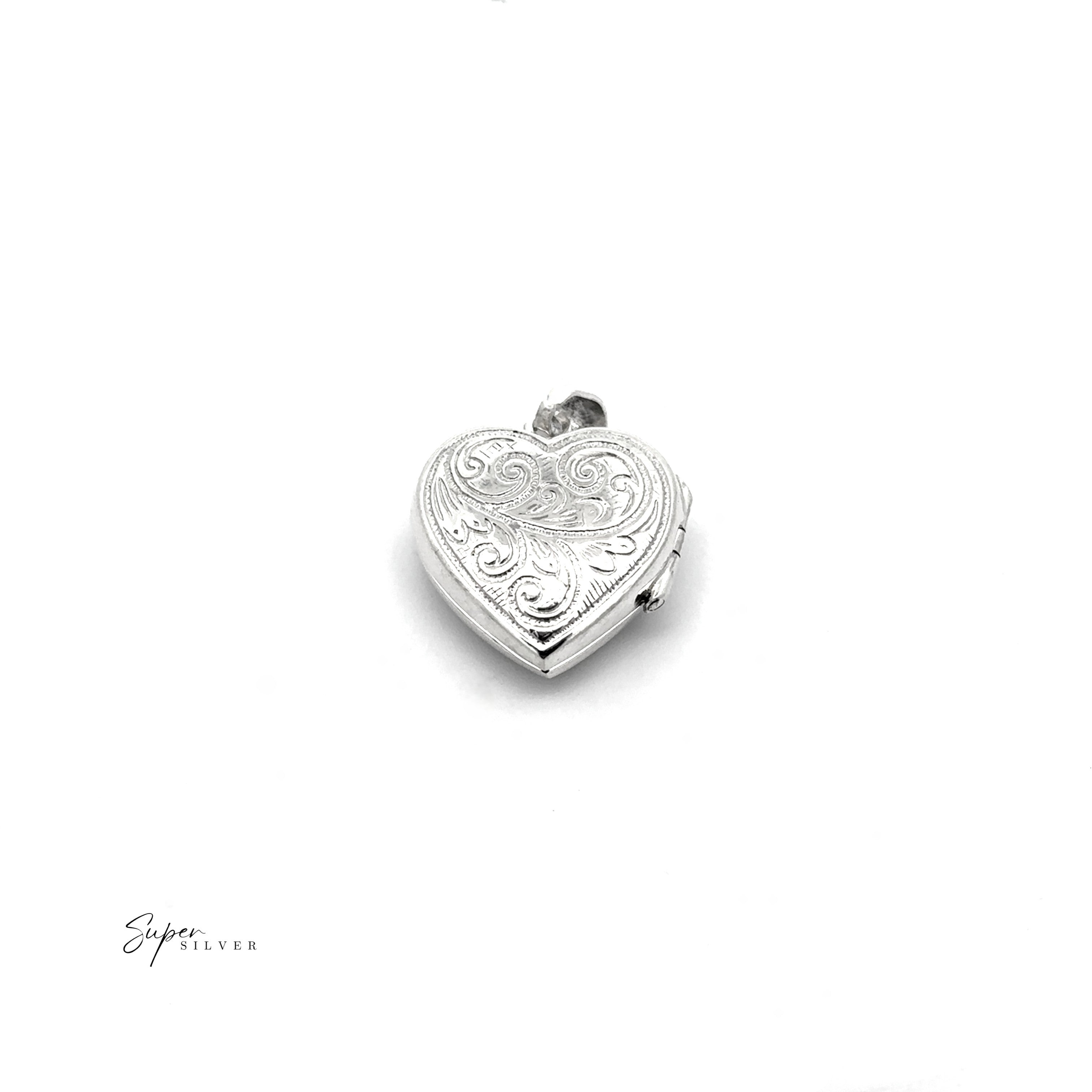 The Timeless Heart Locket is a vintage-inspired, silver heart-shaped pendant with engraved swirl patterns, photographed on a plain white background. The "Super Silver" logo is visible in the bottom left corner.