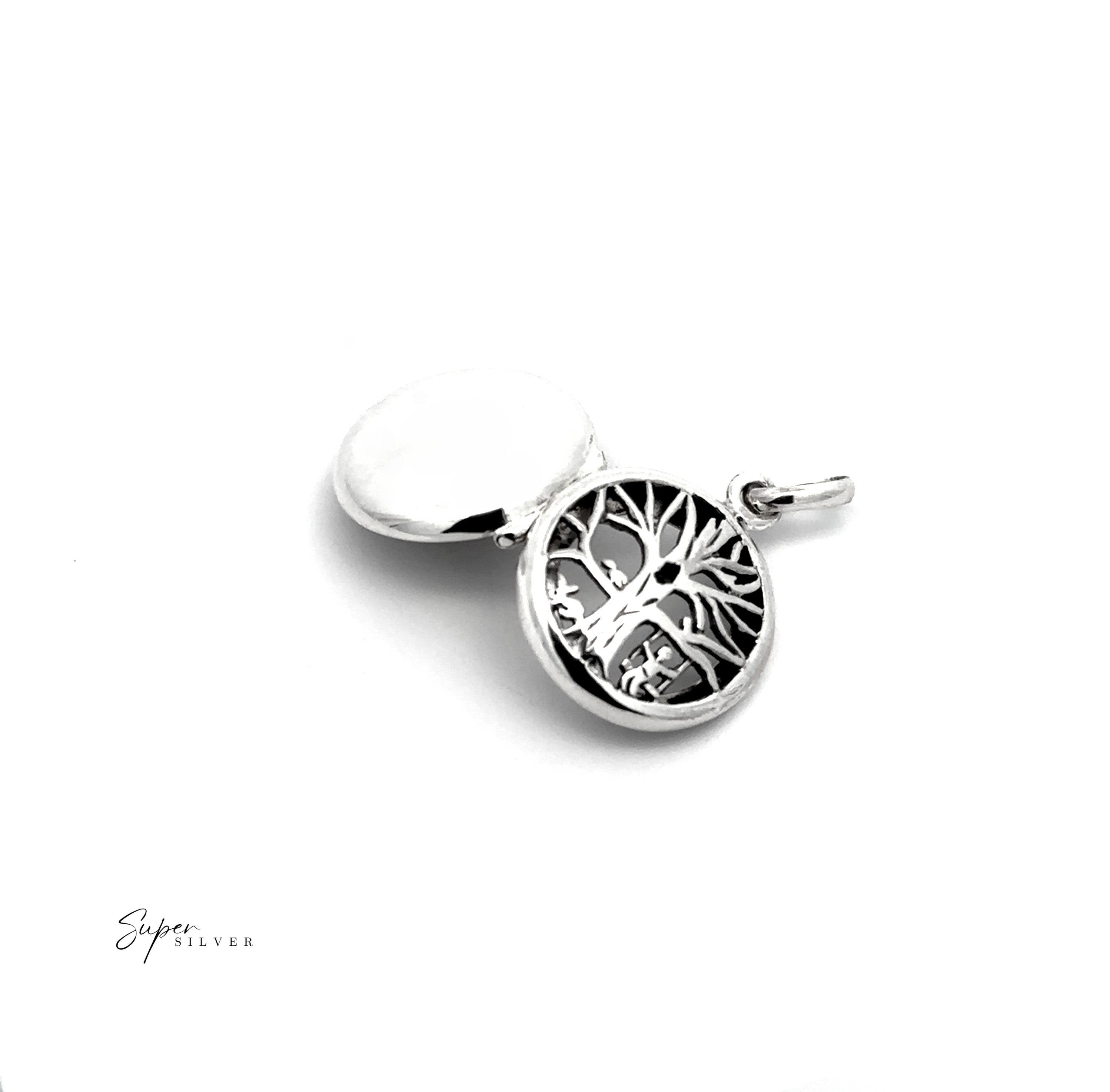 The Tree Locket with Swinging Child is a .925 sterling silver pendant featuring a tree of life design, shown with a plain circular backing on a white background—an elegant, timeless jewelry piece.