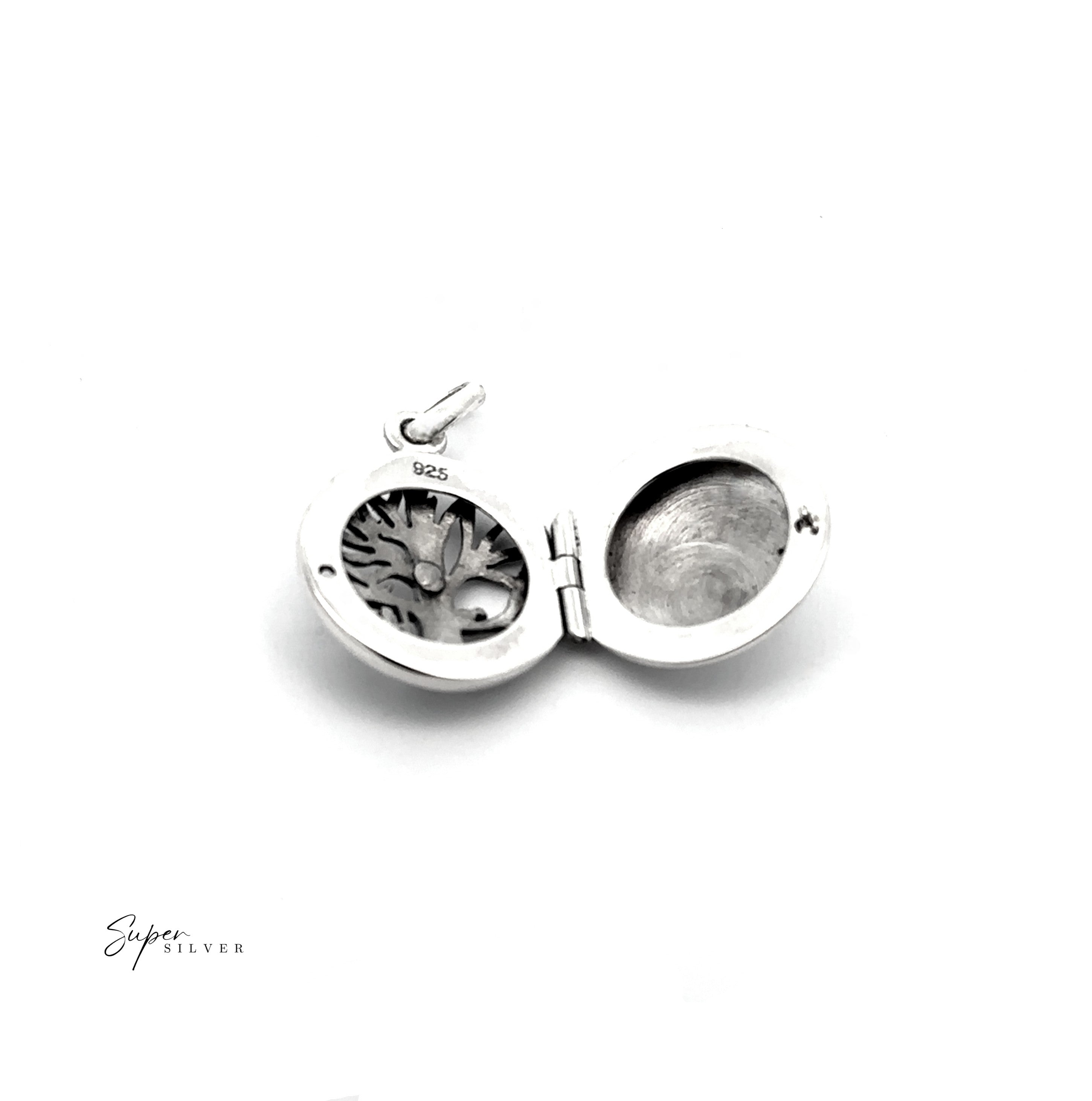 The Tree Locket with Swinging Child is a .925 sterling silver pendant featuring a tree design with a child on a swing, shown open to reveal its interior compartments—a timeless and elegant piece of jewelry.