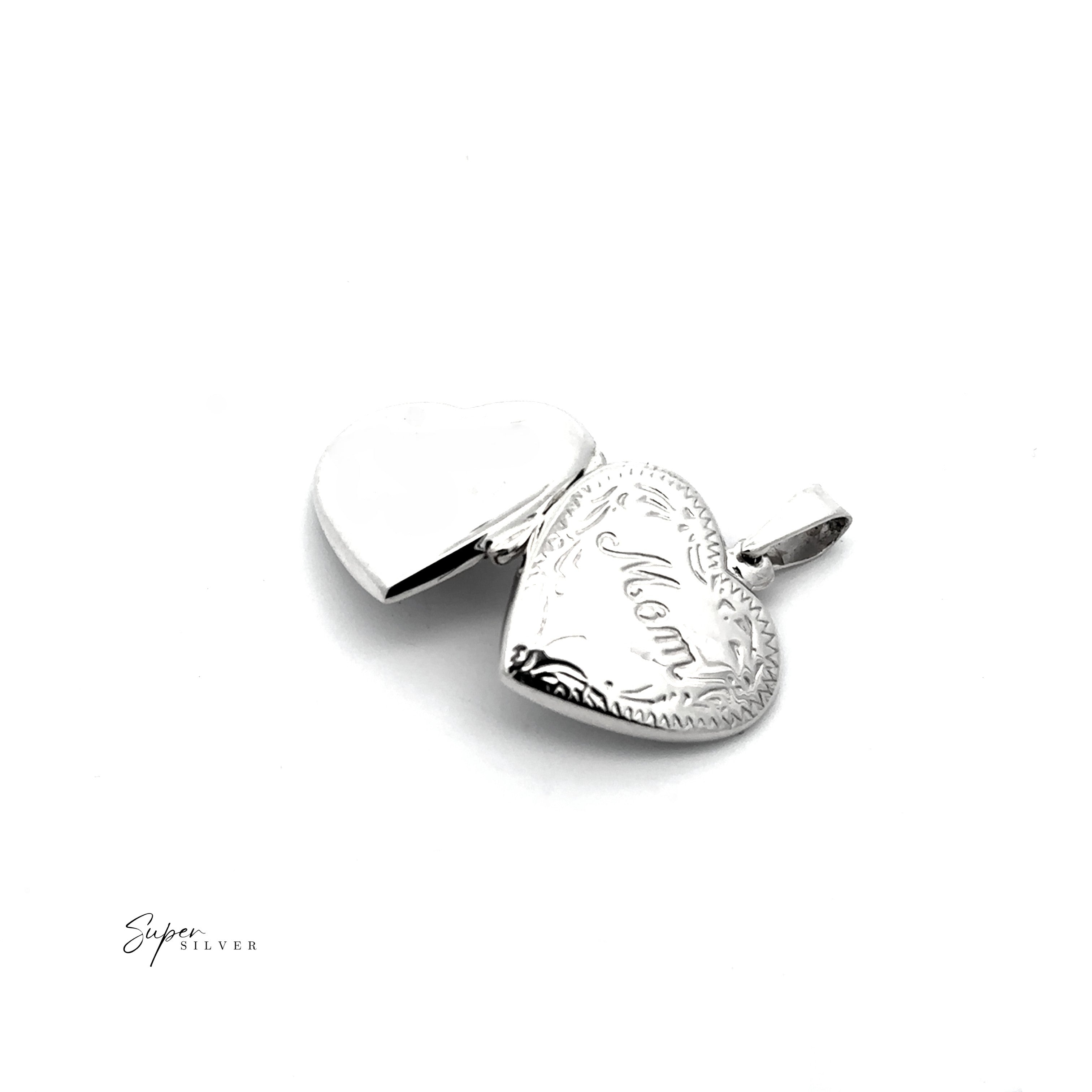 The Heart Shaped "Mom" Locket in sterling silver, featuring "Mom" engraved on the front and shown partially open, is displayed against a white background.