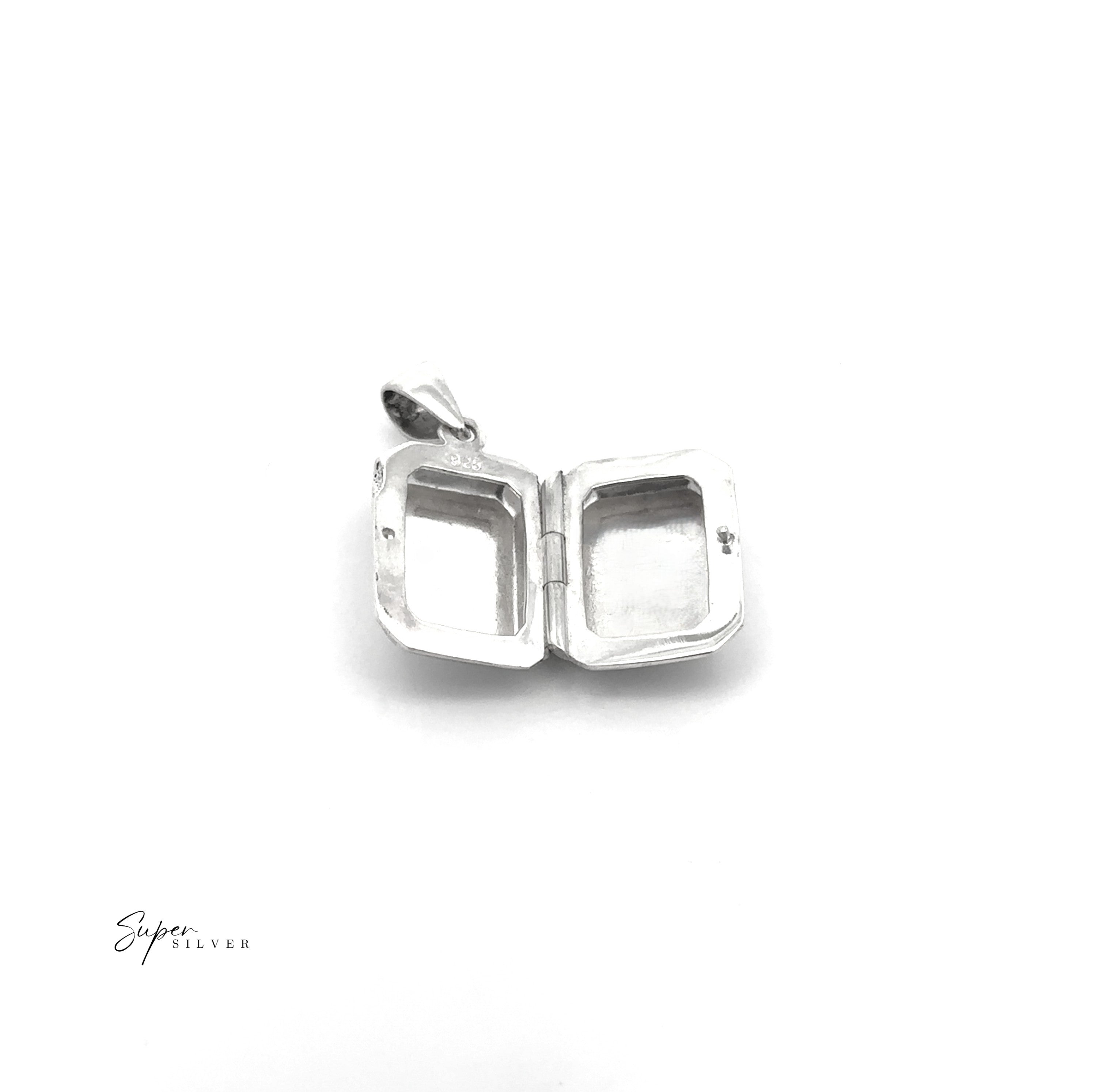 The Beveled Edge Rectangular Locket is a minimalist silver pendant with two empty compartments and a small bail for attaching to a chain—ideal for keeping cherished memories close.