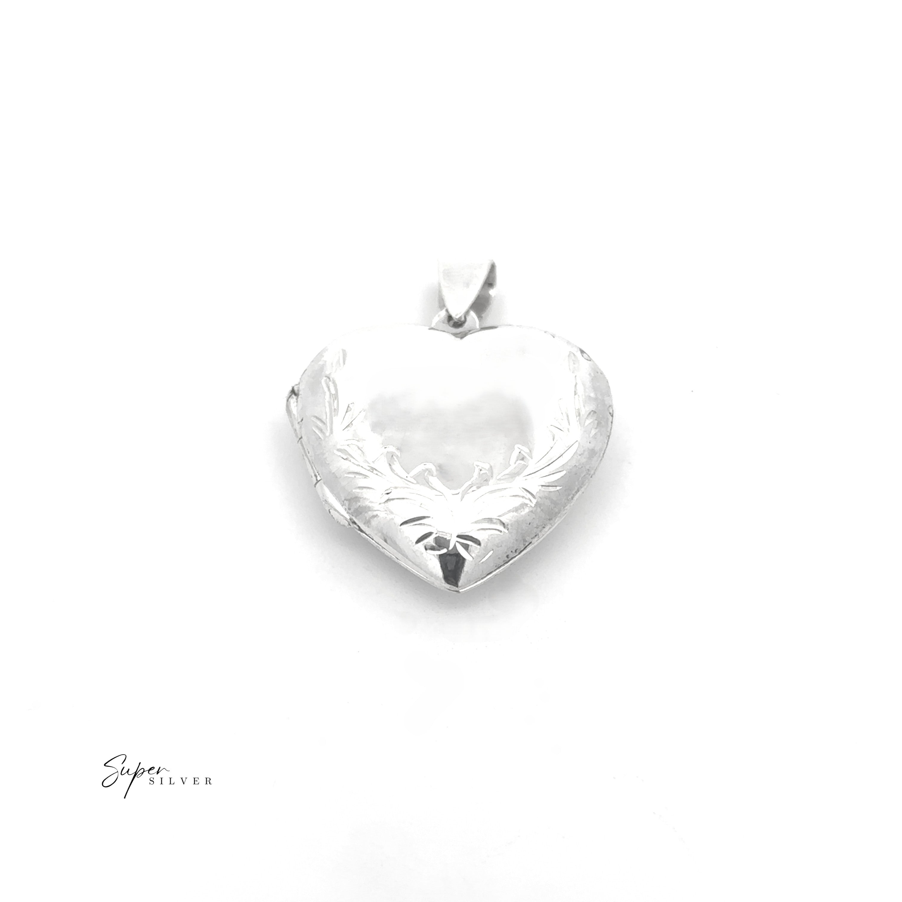 The Heart Locket with Filigree Border, crafted in sterling silver, features delicate engraving on the lower half and is displayed against a white background.