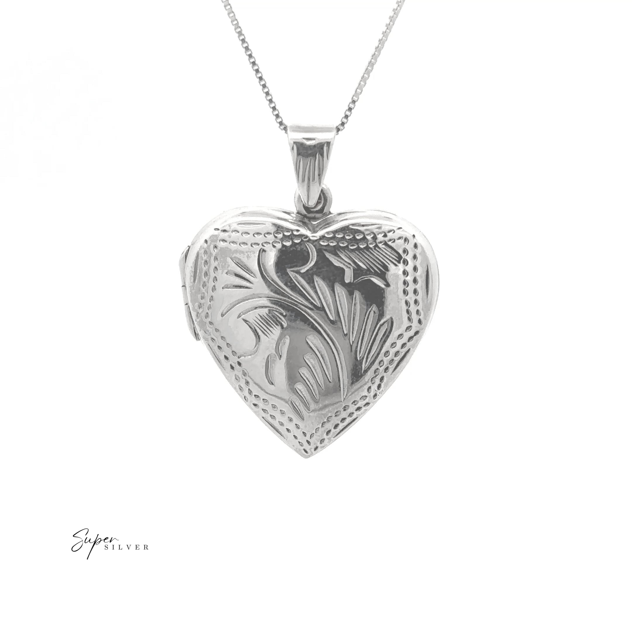 The Timeless Heart Locket is a sterling silver, heart-shaped pendant with an engraved floral pattern on a fine chain, offering vintage charm and shown against a white background.