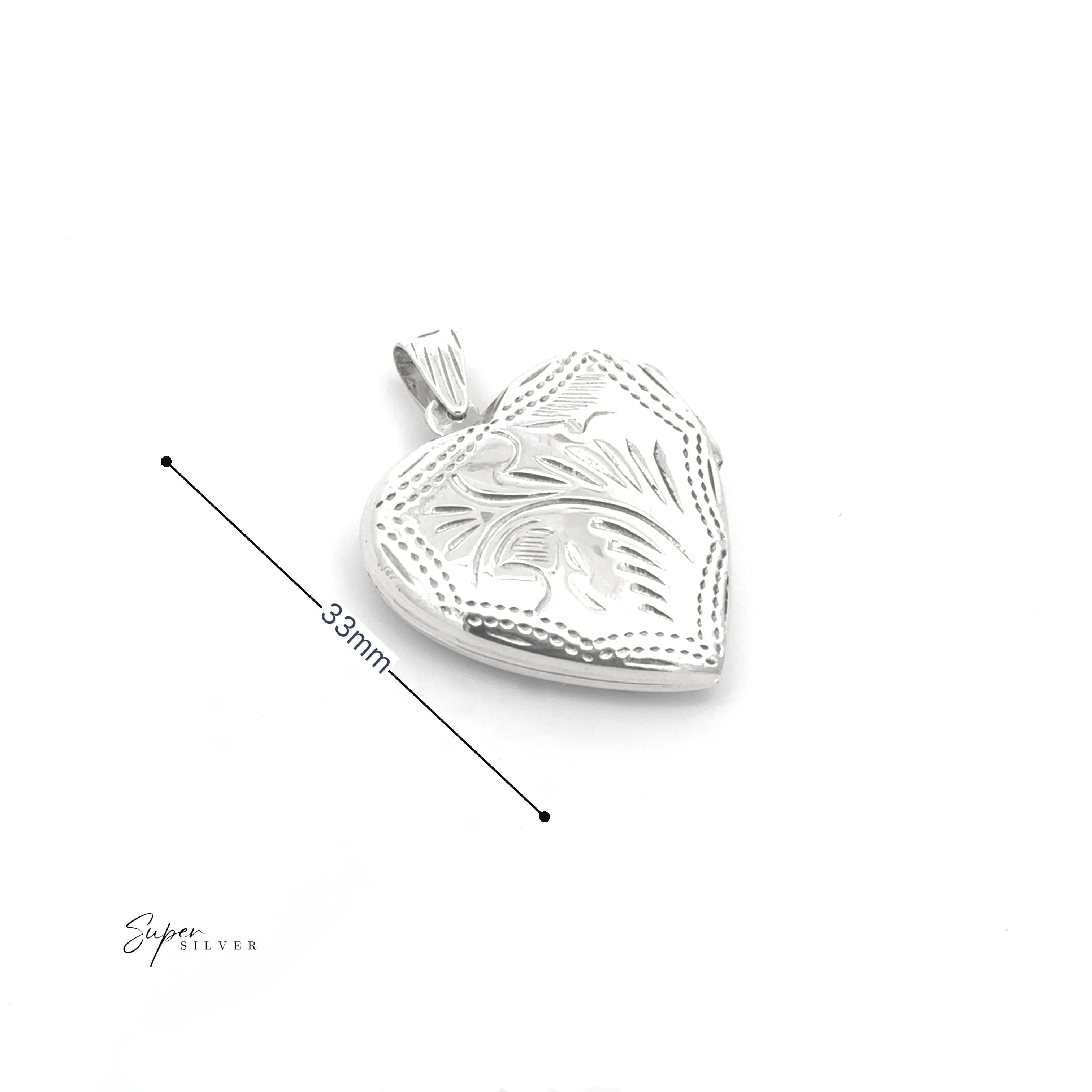The Timeless Heart Locket is a sterling silver, heart-shaped locket with an engraved floral design and vintage charm, measuring 33mm in length and displayed on a white background.