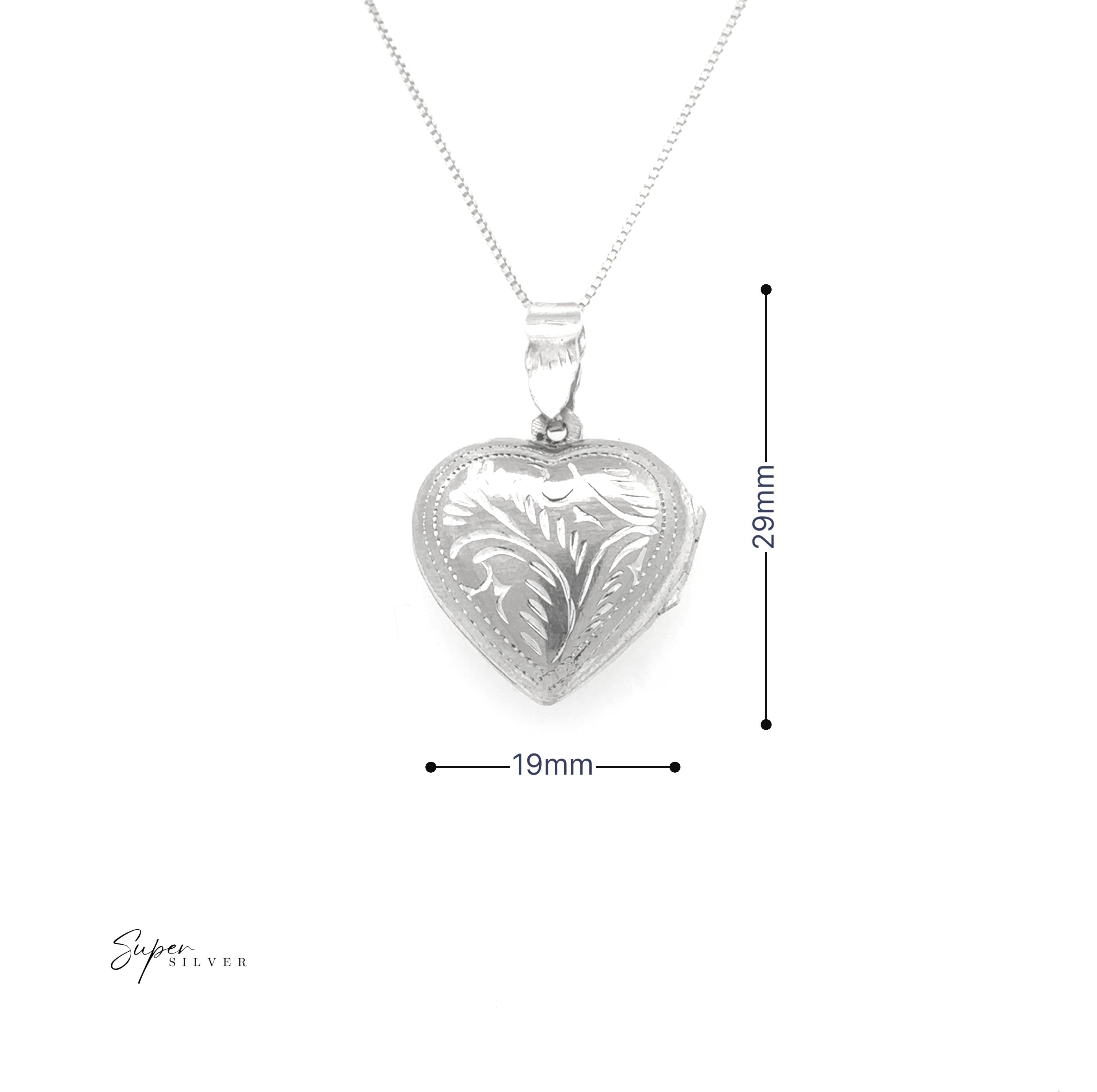 The Timeless Heart Locket, crafted from sterling silver with an engraved heart design (29mm x 19mm), radiates vintage charm as it hangs on a fine chain against a white background.