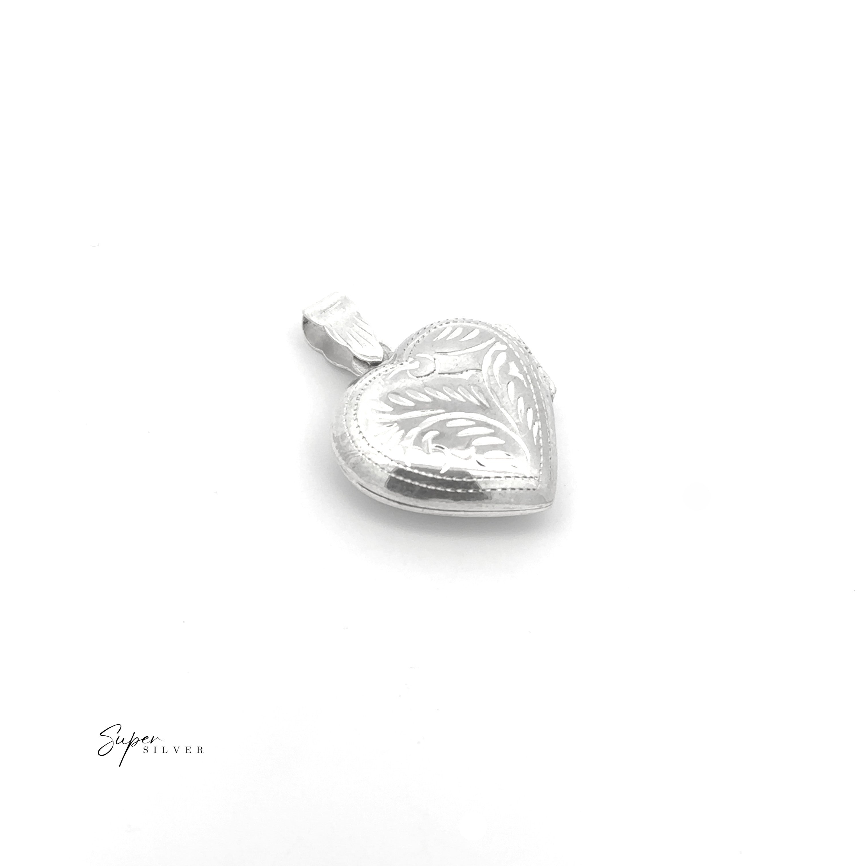 The Timeless Heart Locket, crafted in sterling silver with intricate leaf engravings, exudes vintage charm and is elegantly showcased on a white background.