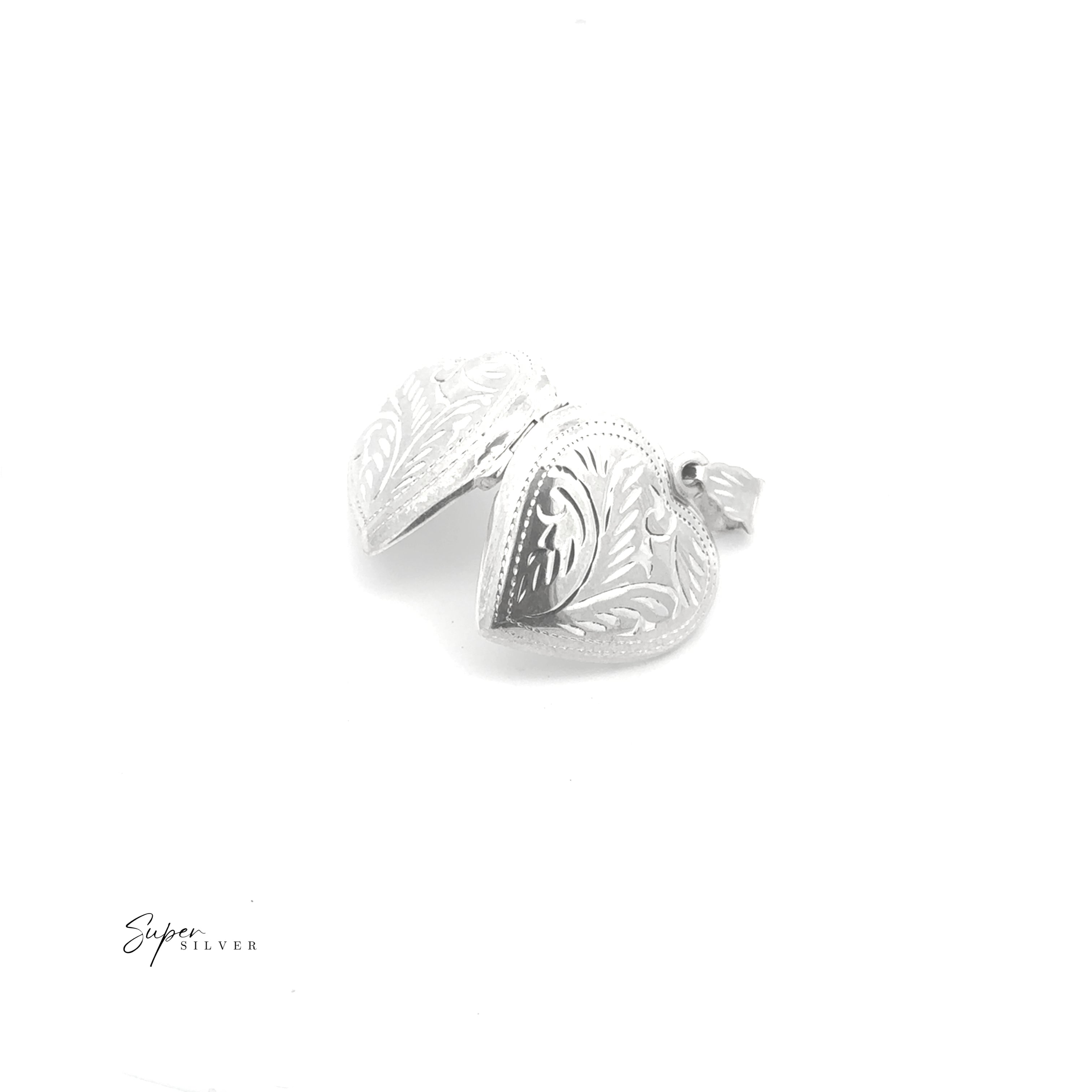 The Timeless Heart Locket, crafted in sterling silver with engraved vintage patterns, is shown partially open against a white background.