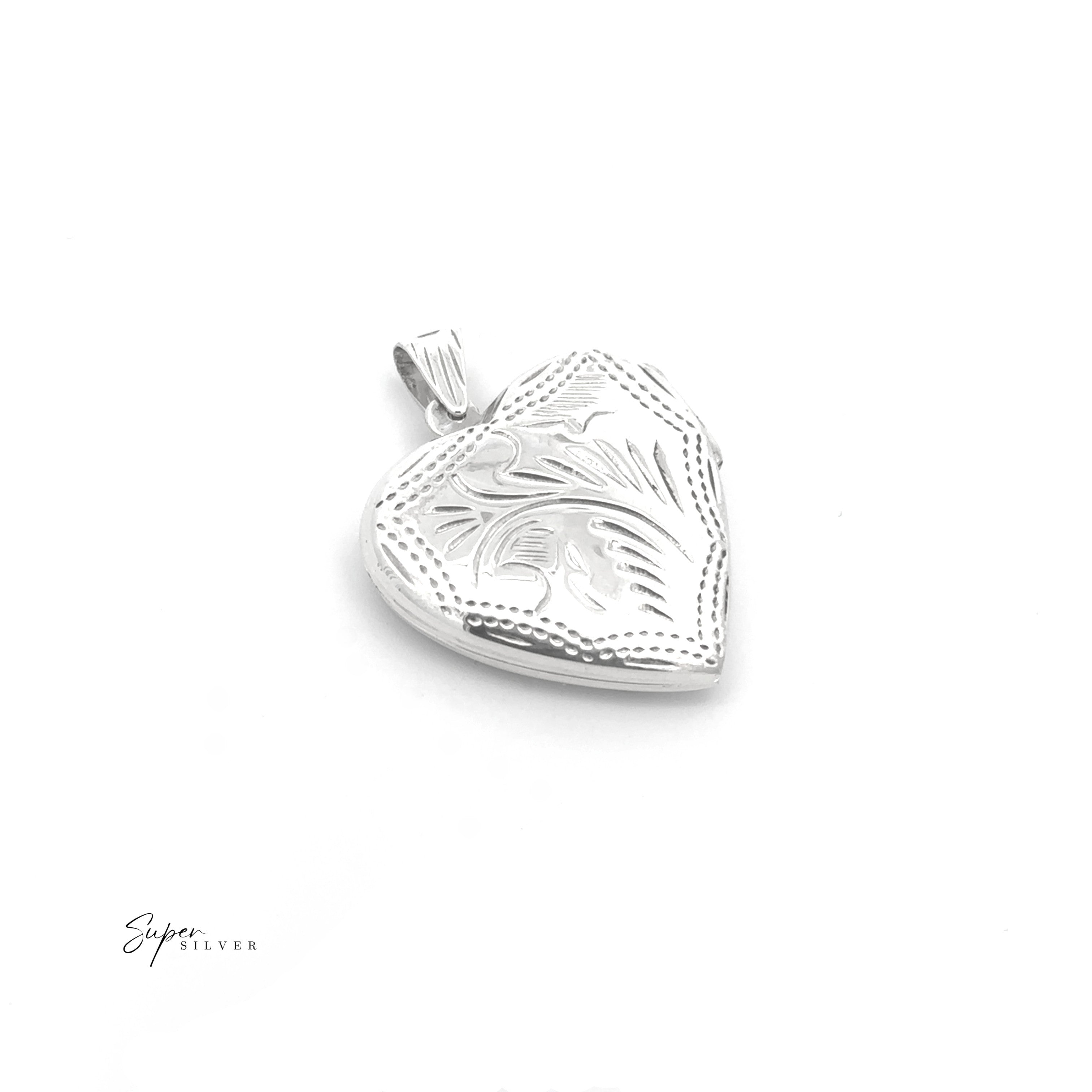 The Timeless Heart Locket is a vintage-style sterling silver piece with engraved floral patterns and a decorative bail, shown on a white background.