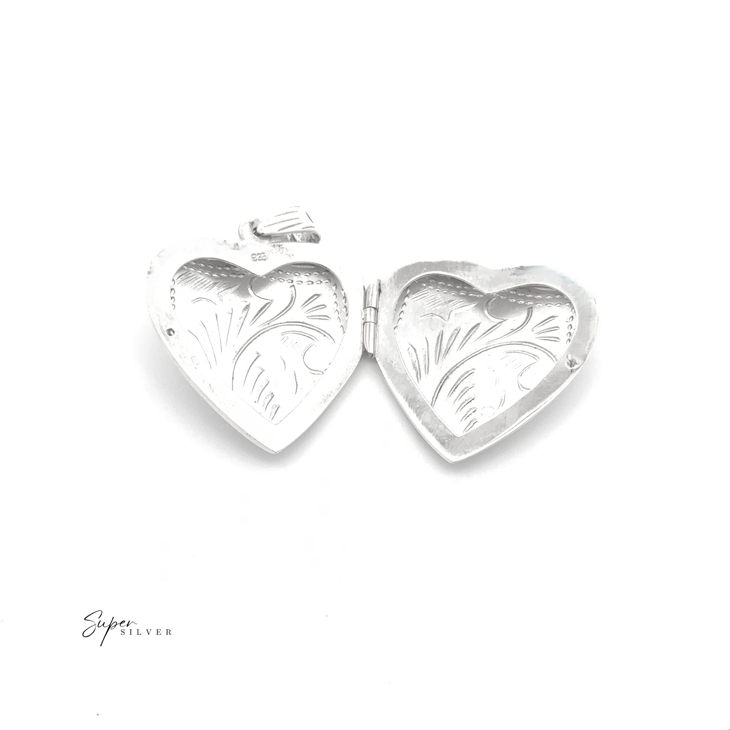 The Timeless Heart Locket, crafted in sterling silver with engraved patterns, offers vintage charm. Its heart-shaped design reveals both inner and outer details, elegantly displayed against a white background.