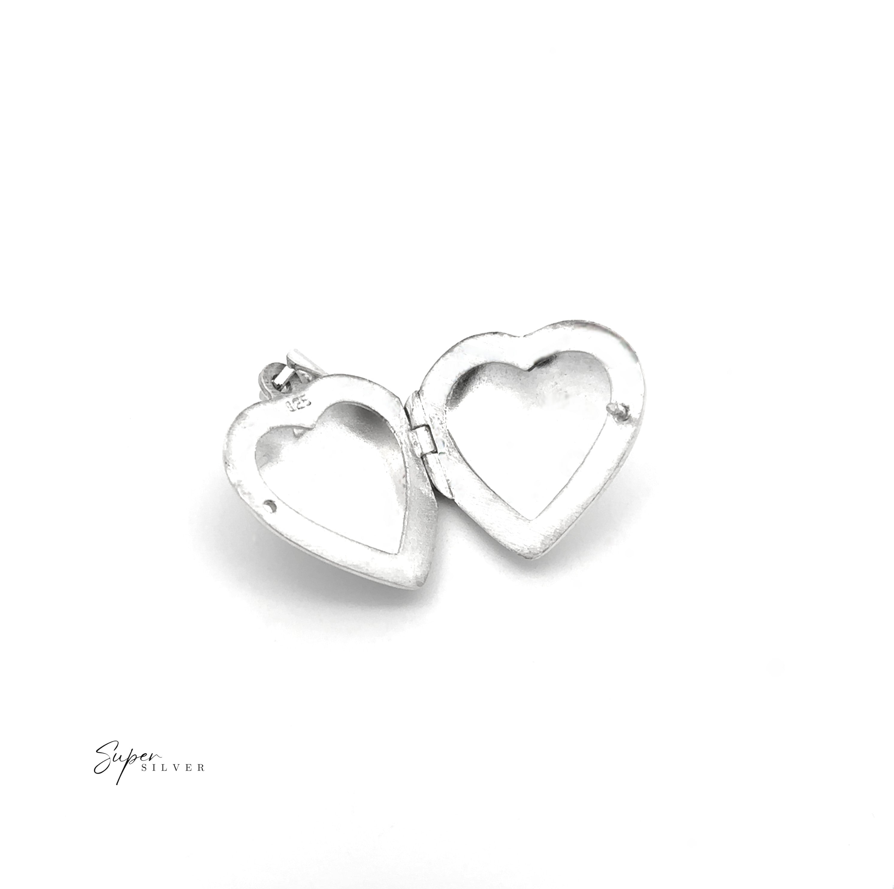 The Plain Heart Lockets are open heart-shaped sterling silver lockets with two empty photo spaces, shown on a white background—a timeless tribute jewelry piece.