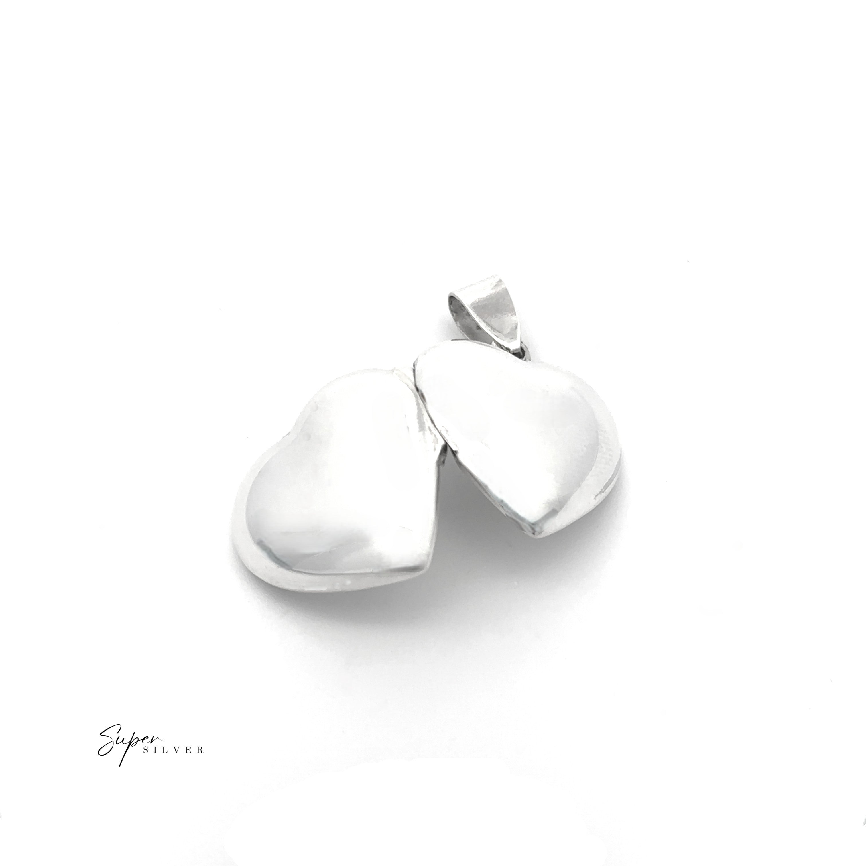 A Plain Heart Locket, heart-shaped and slightly open, rests on a white background. This sterling silver locket features "Super Silver" inscribed in the lower left corner.