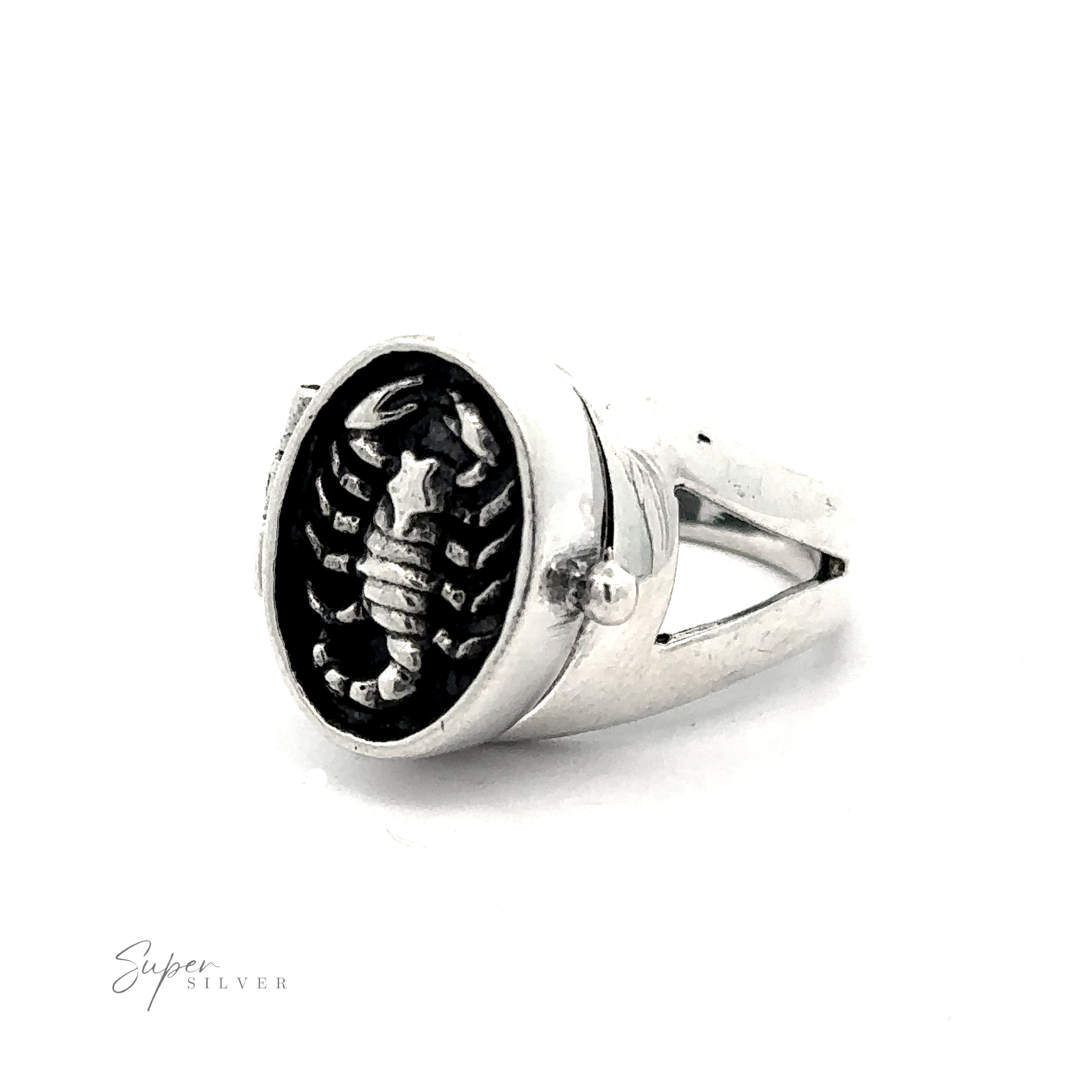 A Scorpion Poison Ring featuring a detailed scorpion design on a black background is displayed against a white backdrop. The ring has a broad band with cut-out sides, embodying the Scorpio zodiac's mystique. "Super Silver" is written in the bottom left corner.