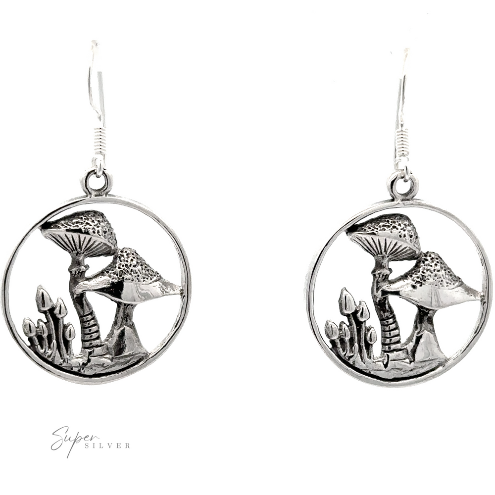 A pair of Trippy Encircled Mushroom Earrings hanging from hooks.