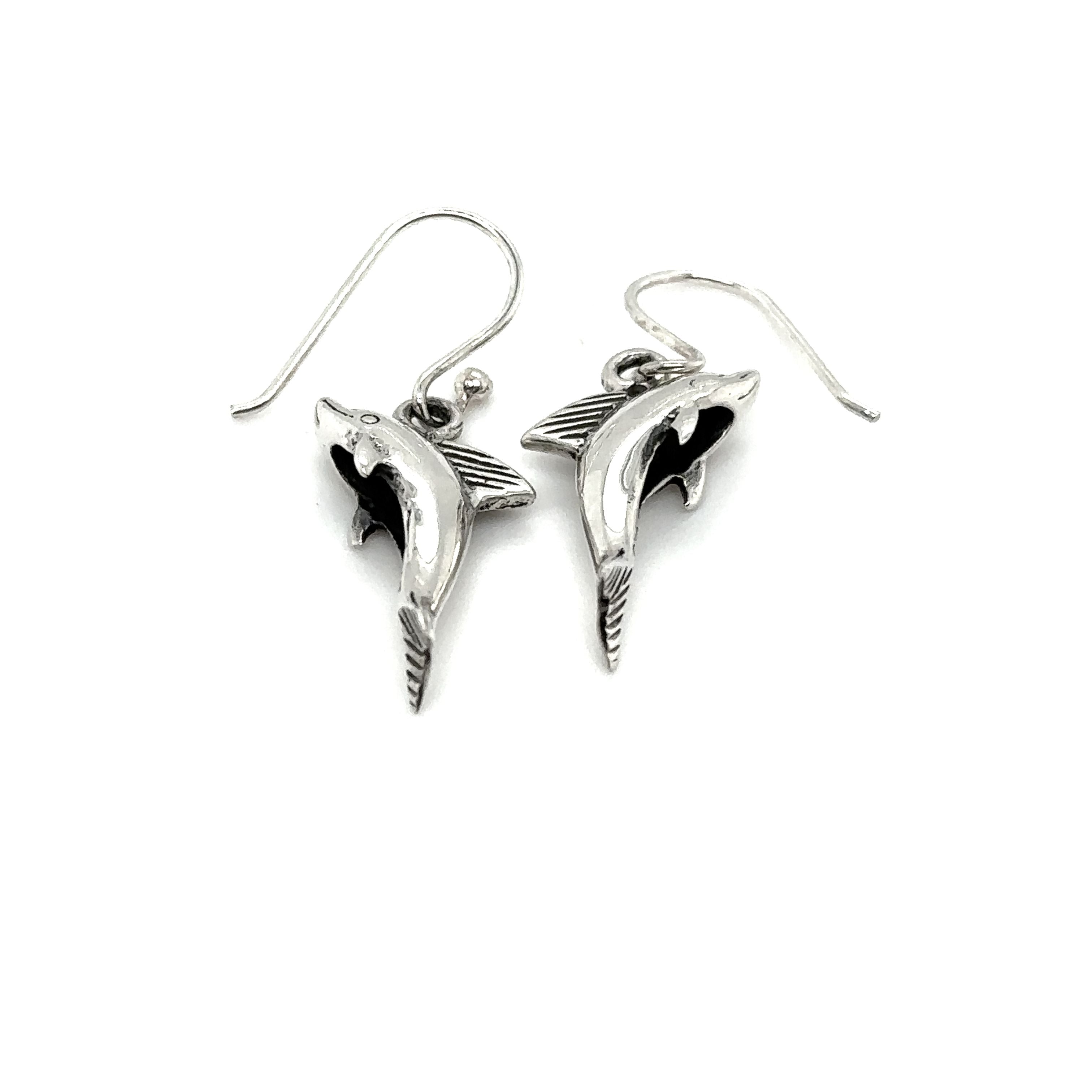 A pair of Super Silver Dolphin Earrings on a white background.