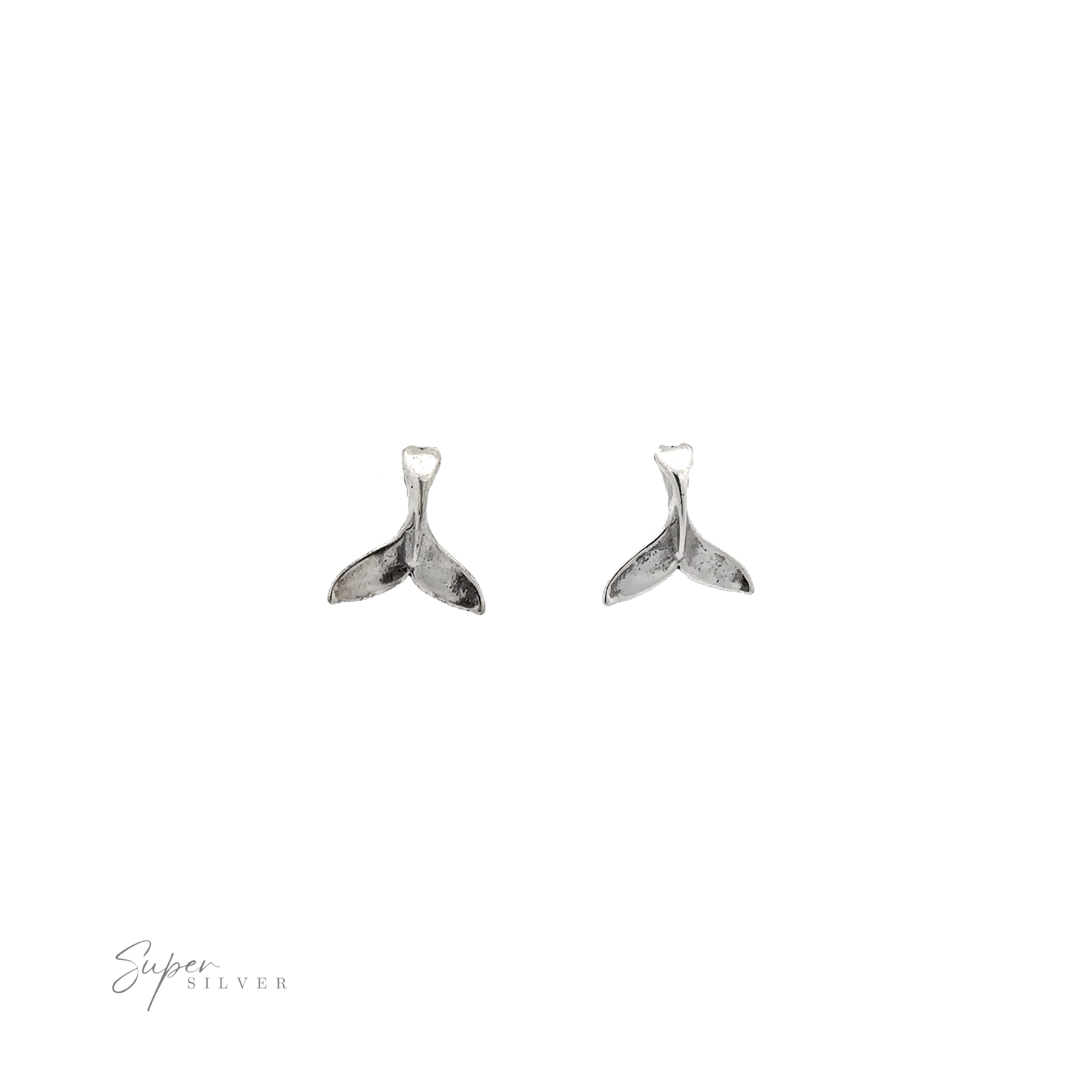 A pair of Whale Tail Studs, an ocean-inspired accessory, showcased on a white background.