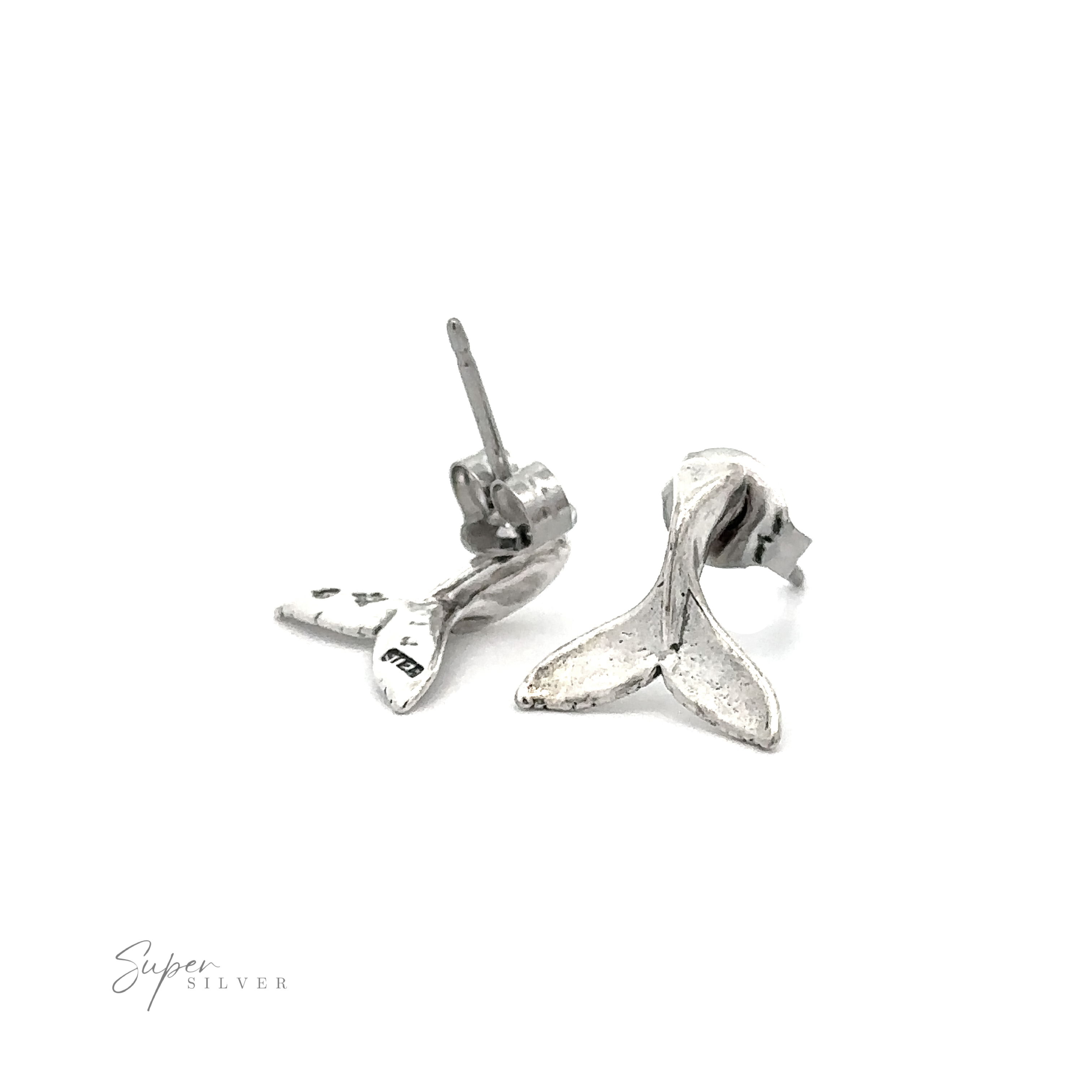 A pair of silver ocean-inspired Whale Tail Studs, perfect as a stylish accessory.