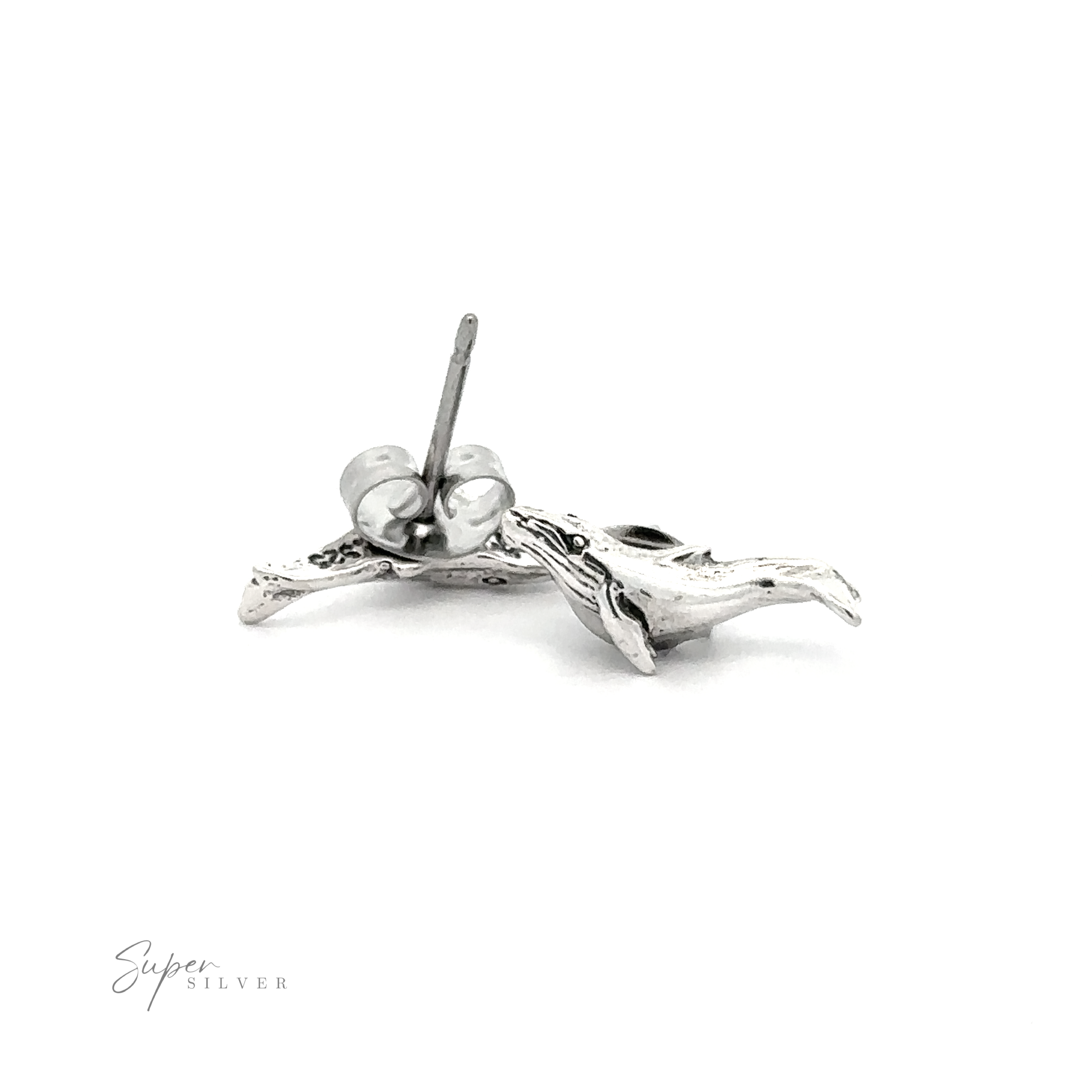 A pair of Whale Studs on a white background.
