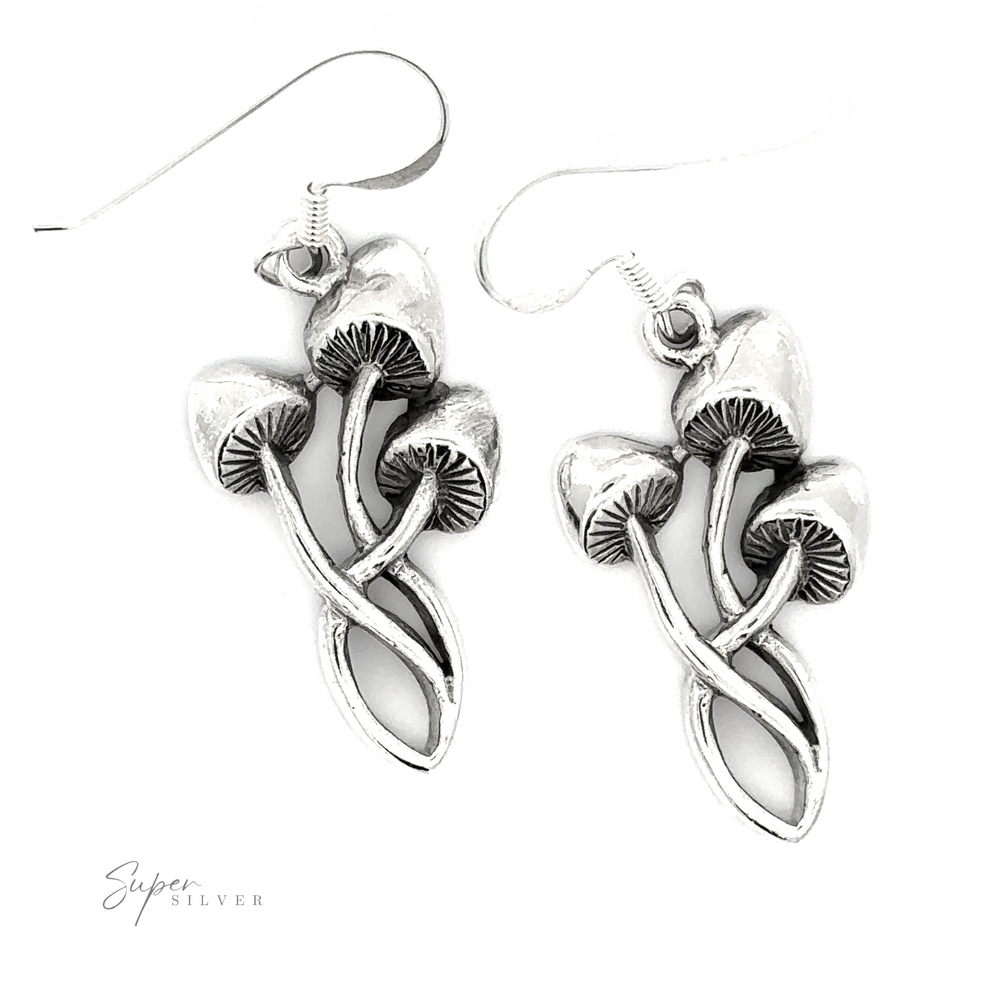A pair of Mushroom Earrings, displayed against a white background with a signature reading "super silver," exude a nature-inspired charm.