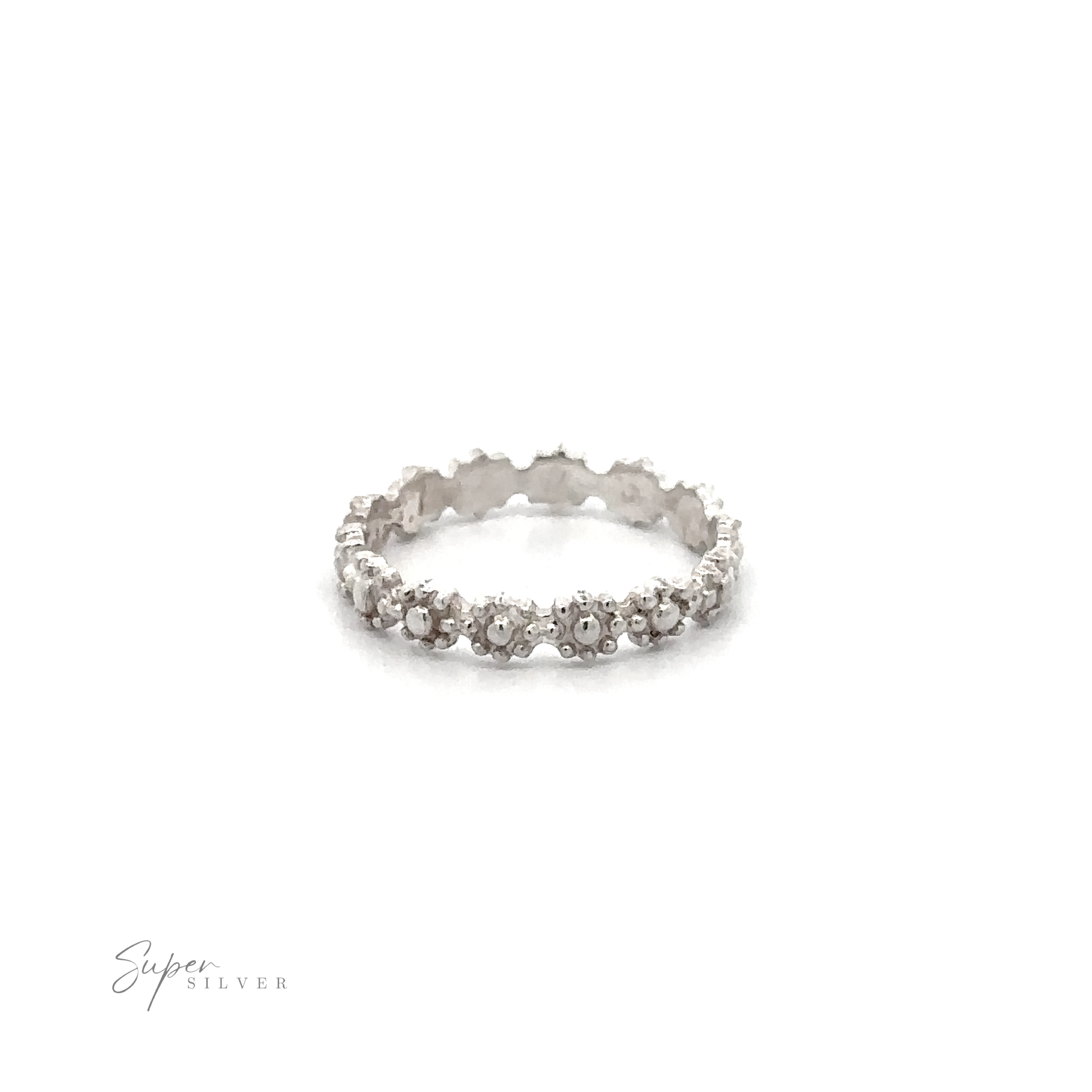 Flowers Band Ring with encrusted gemstones on a white background.