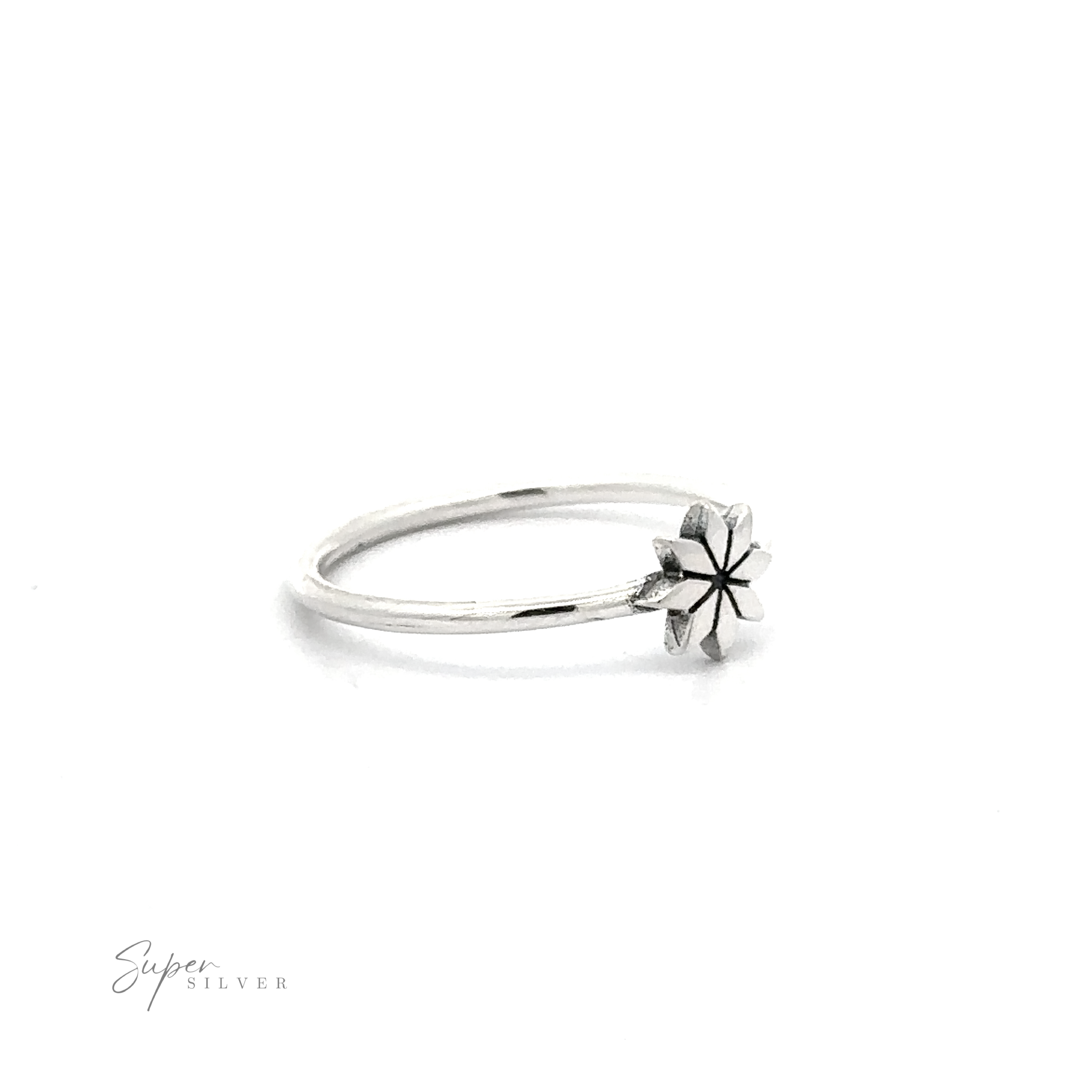 Geometric Flower Ring .925 sterling silver ring with a star-shaped setting on a white background.