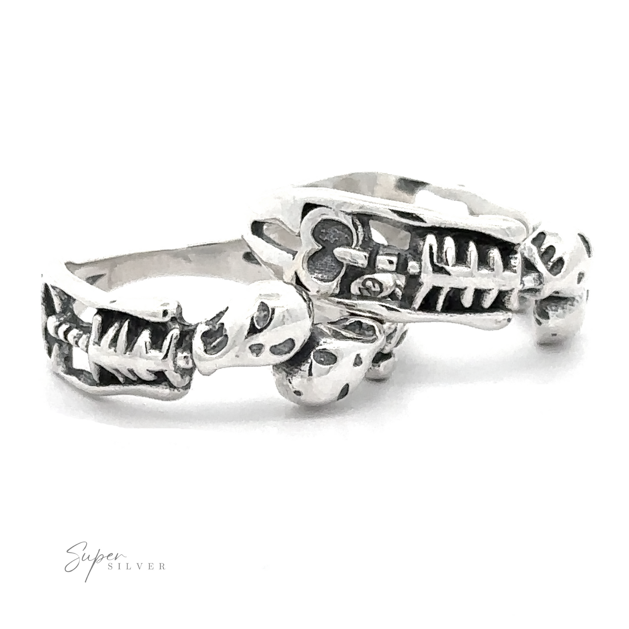 Three Skeleton Rings featuring skeleton and skull designs displayed on a white background.