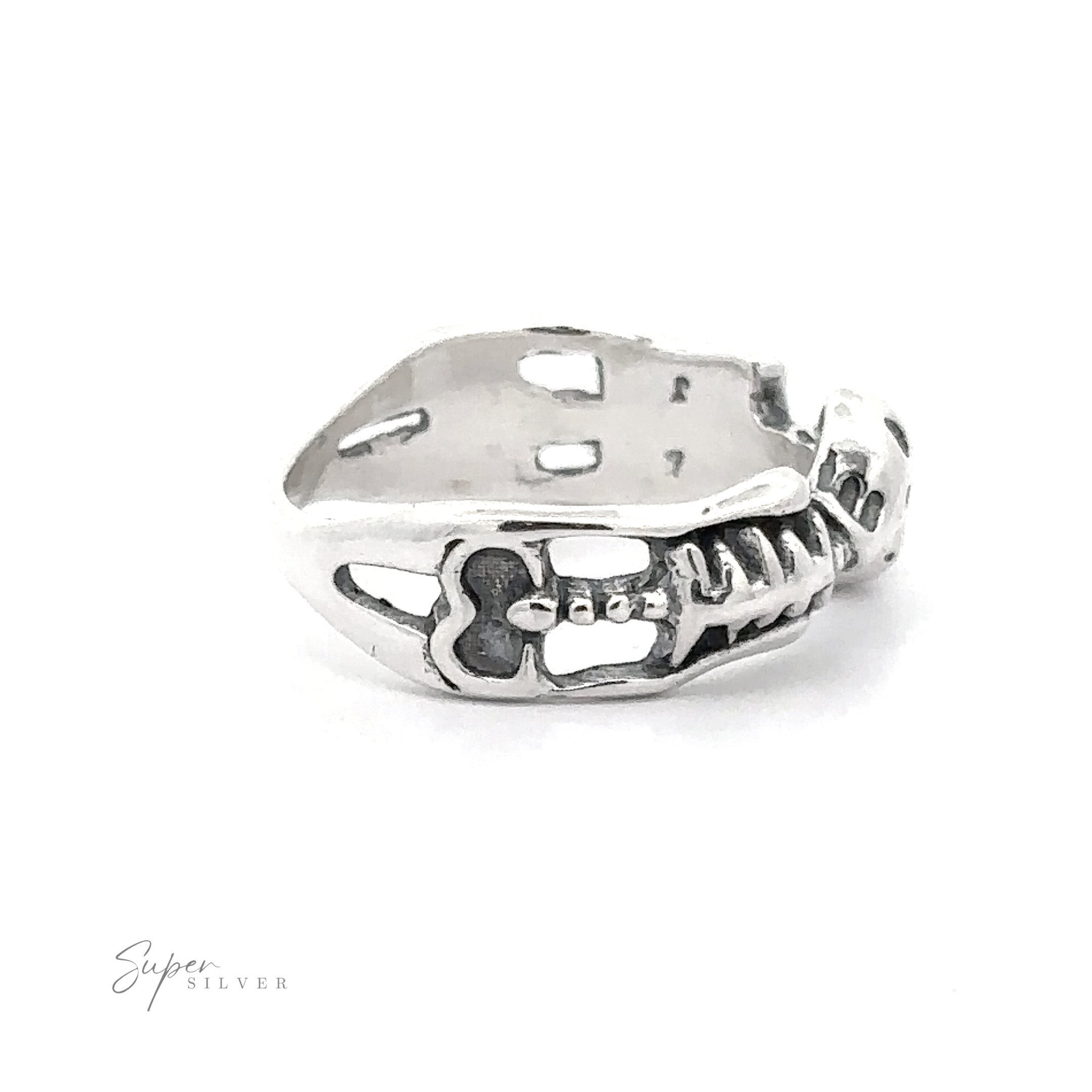 Skeleton ring with intricate cut-out details and floral patterns on a white background, crafted from .925 Sterling Silver.