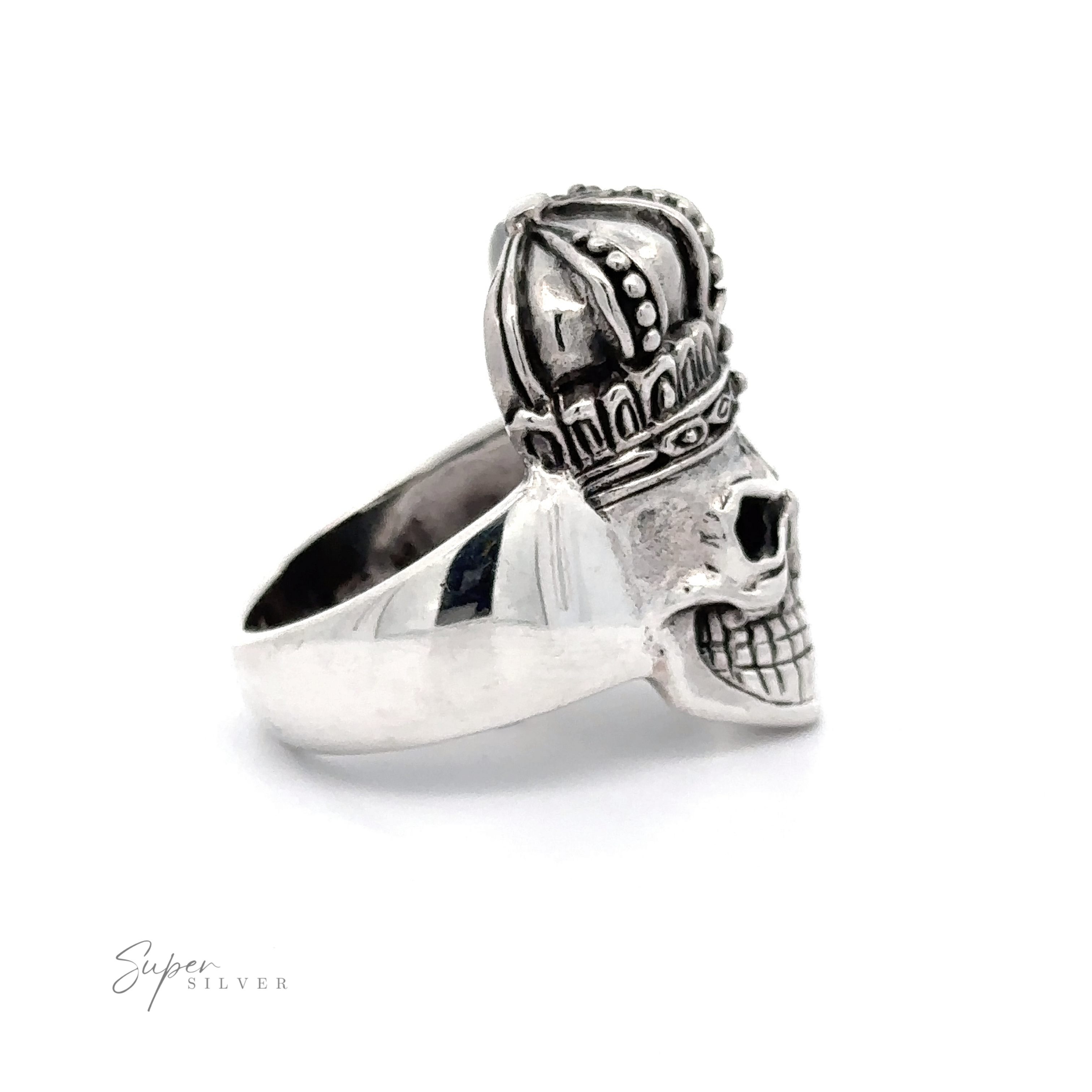 A bold and intricate Skull King Ring featuring a detailed skull wearing a king's crown. The silver ring boasts the words "Super Silver" lightly inscribed in the lower left corner.