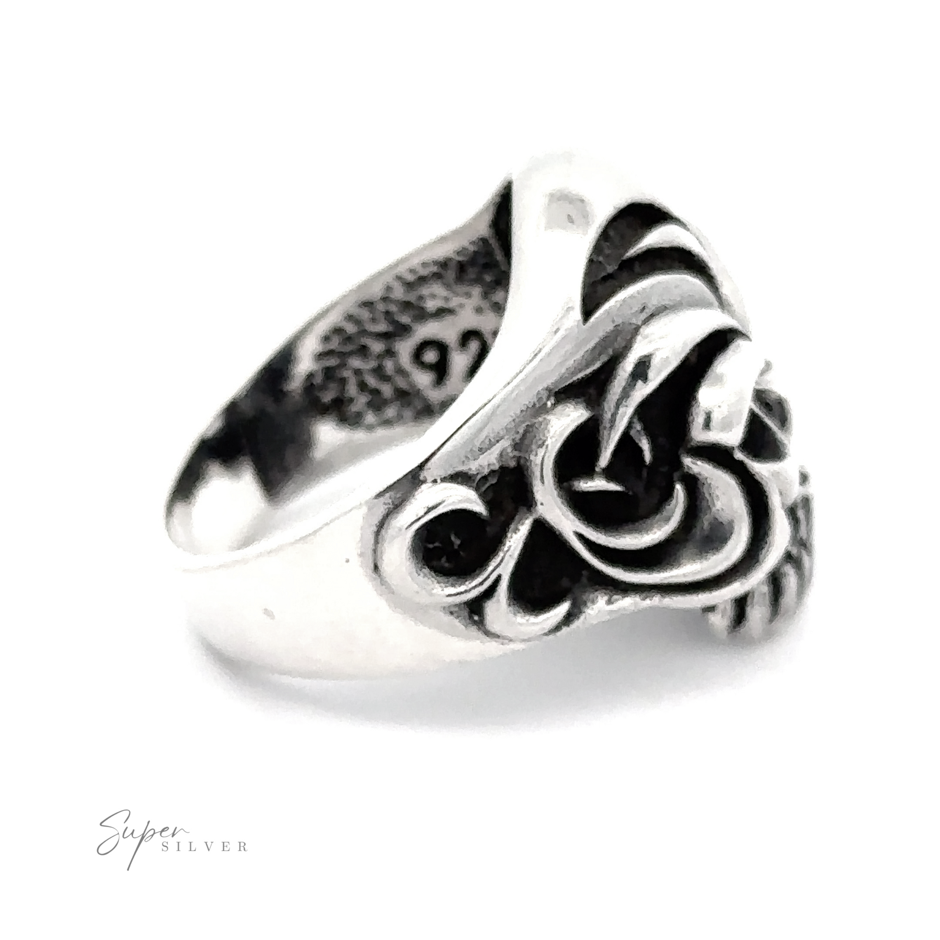 A Large Carved Skull Ring featuring a detailed lion's head design with black accent stones and an engraved inscription on the inner band. The text "Super Silver" appears in the bottom left corner, offering a bold style for those who appreciate unique accessories.