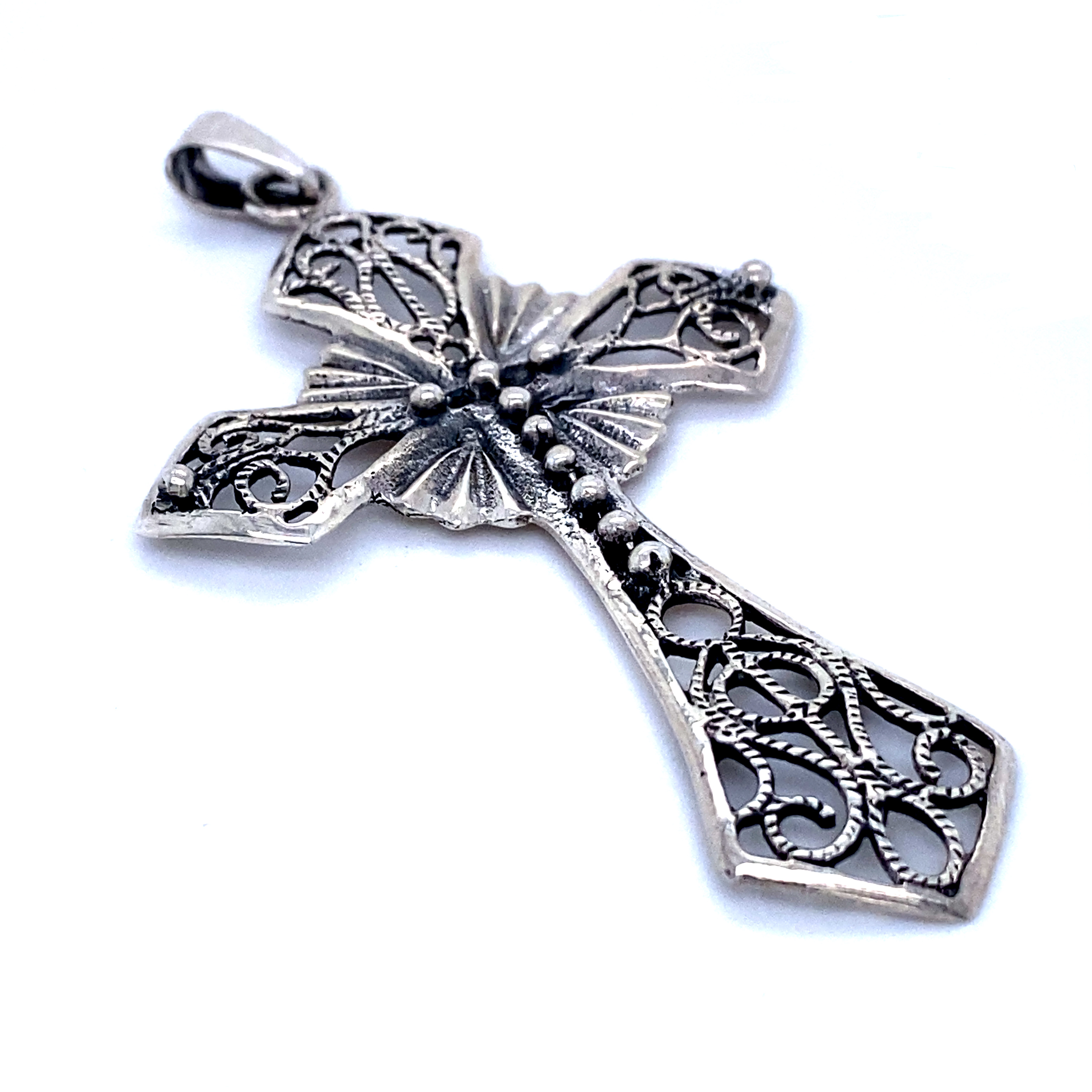 A unique piece of silverwork, a Super Silver Ornate Cross Pendant, displayed on a white background.