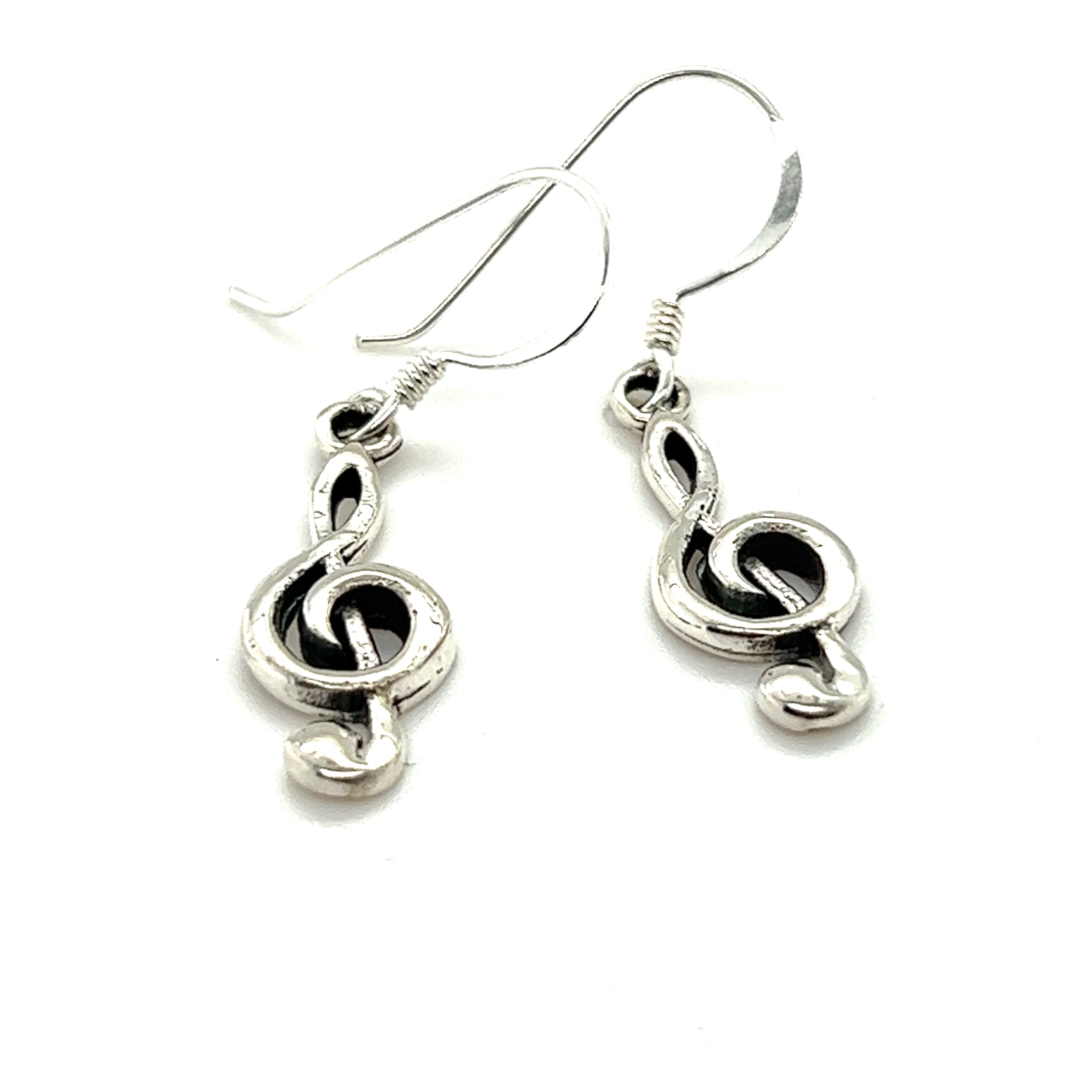 A pair of Super Silver Treble Dangling Earrings on a white background, perfect for music enthusiasts and musicians.