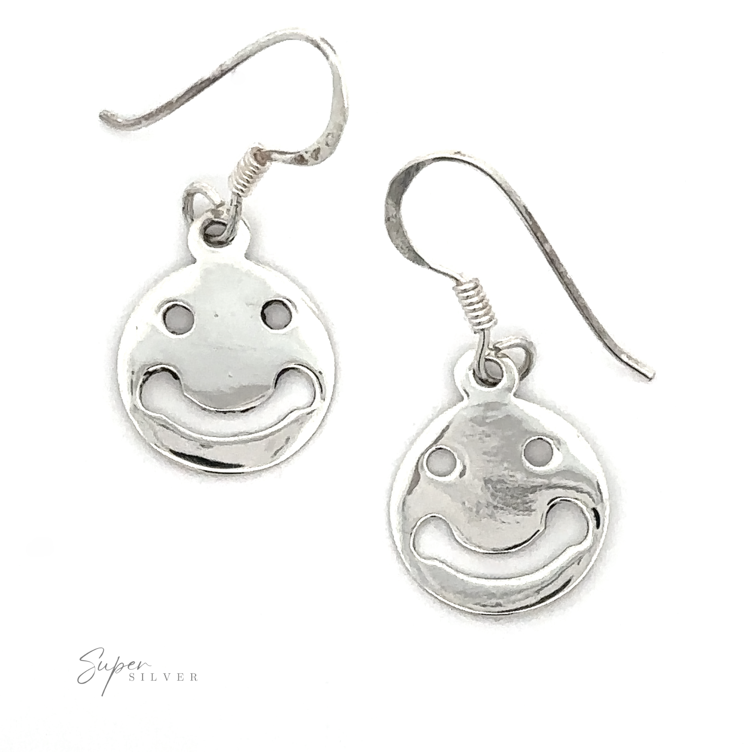 A pair of Smiley Face Earrings with hook fastenings, isolated on a white background, with a signature at the bottom right.