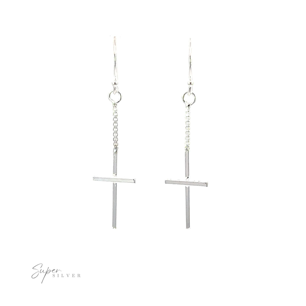 A pair of Minimalist Chain Cross Earrings crafted from .925 Sterling Silver on a white background.