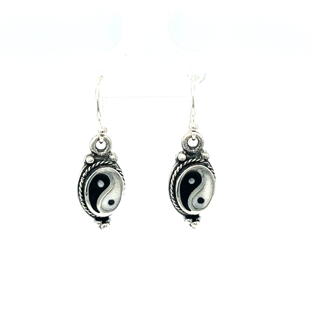 
                  
                    Balance and harmony are perfectly embodied in these stunning Yin-Yang earrings with Rope Border. Crafted with meticulous attention to detail, these black and white earrings exude a timeless beauty that effortlessly complements any ensemble.
                  
                