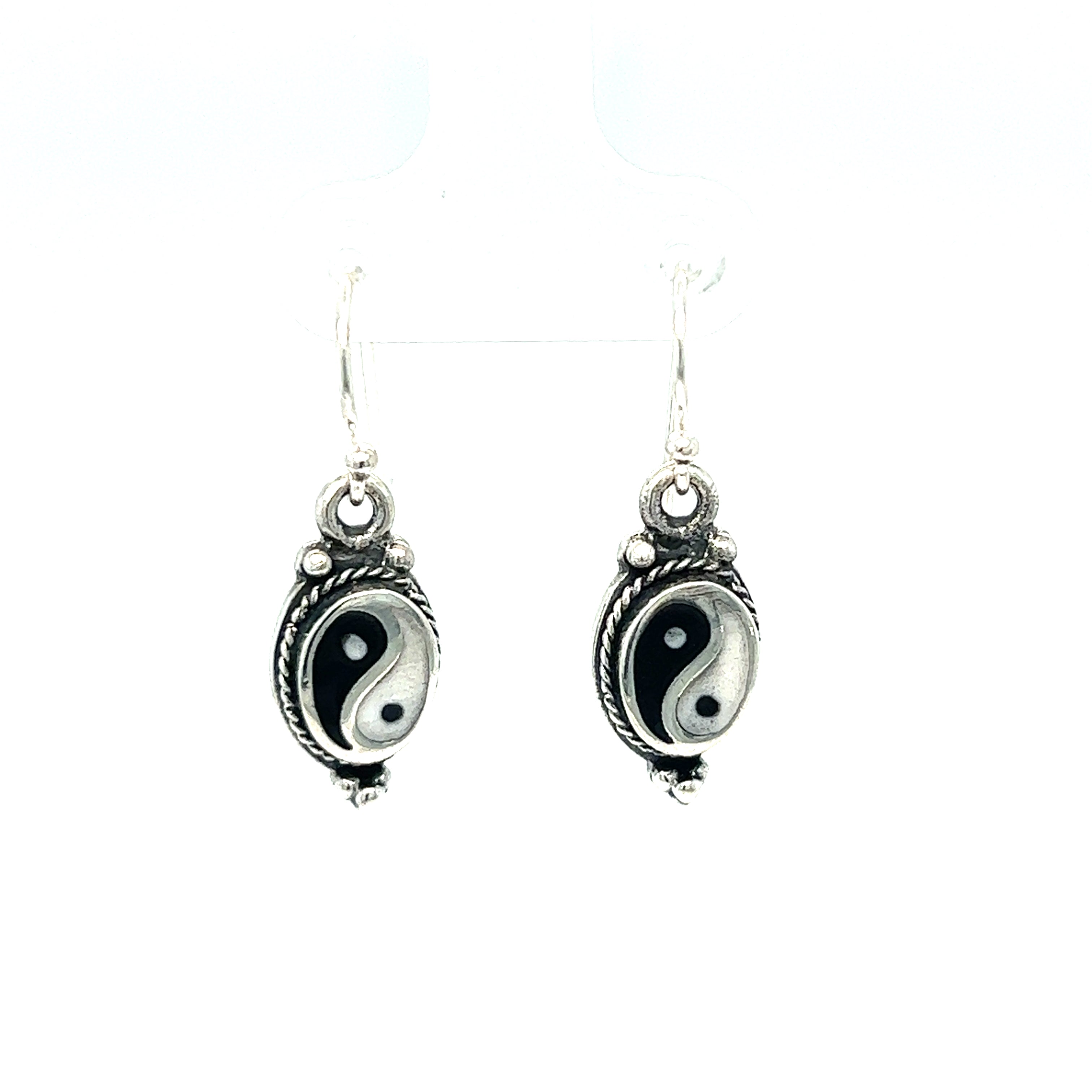 Balance and harmony are perfectly embodied in these stunning Yin-Yang earrings with Rope Border. Crafted with meticulous attention to detail, these black and white earrings exude a timeless beauty that effortlessly complements any ensemble.