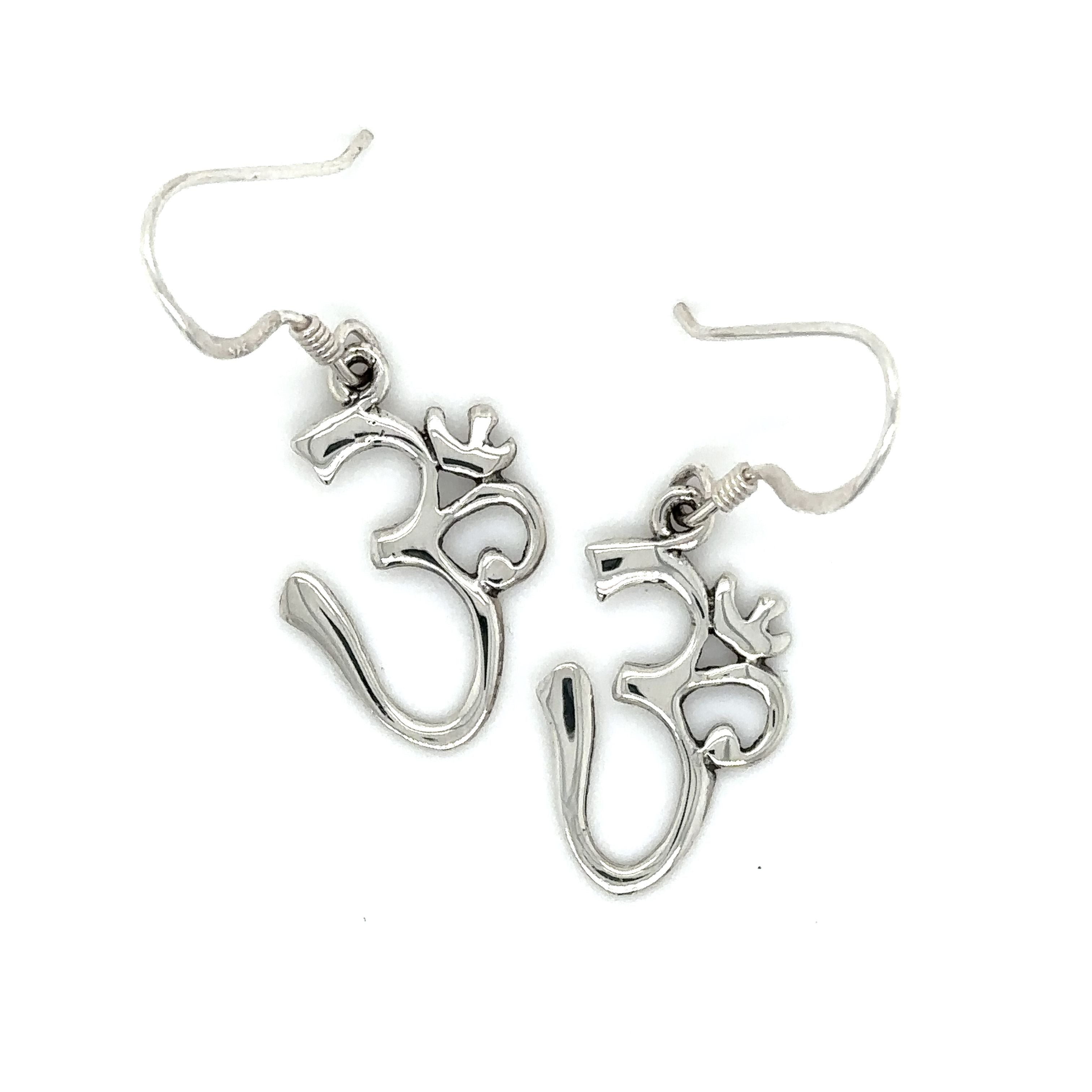These Super Silver Simple Om Earrings feature an om symbol.