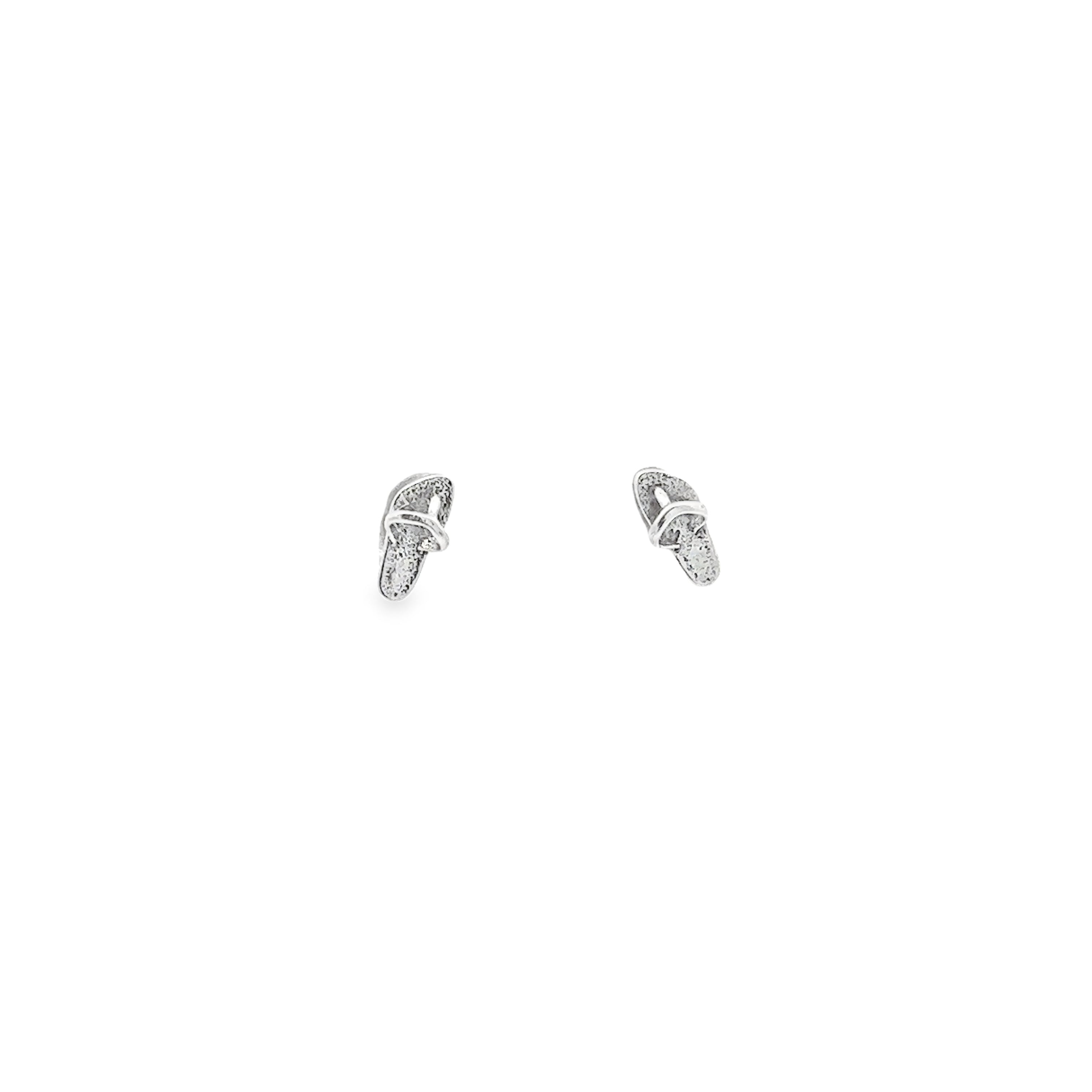 A pair of Sandal Studs on a white background.