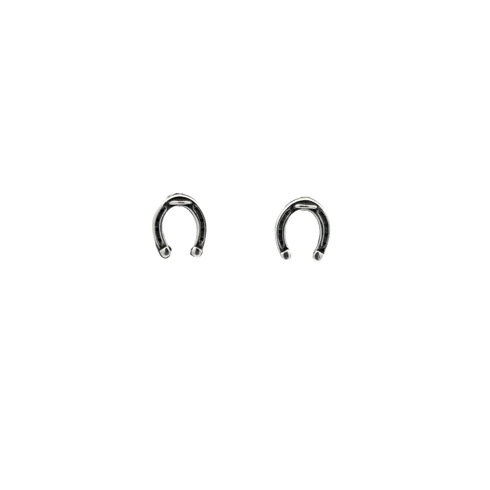 
                  
                    A pair of Horseshoe Studs on a white background, crafted from .925 Sterling Silver for extra luck.
                  
                