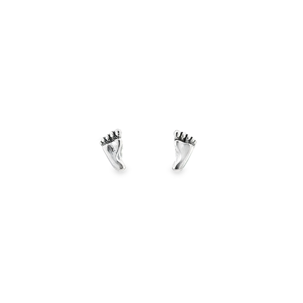 
                  
                    A pair of silver stud earrings with a small Foot Studs detail on a white background.
                  
                