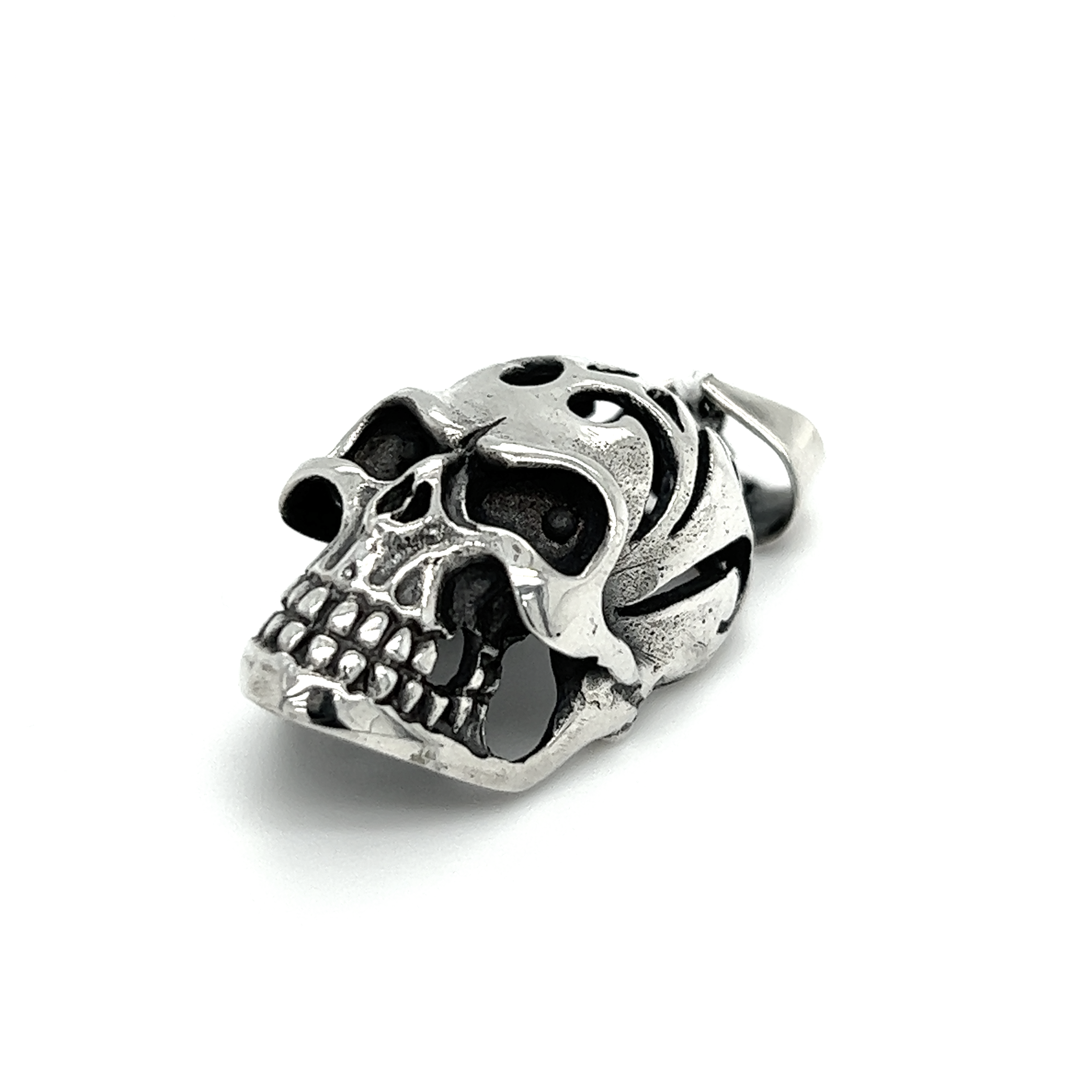 A distinctive Super Silver skull pendant with an oxidized finish and swirl design, displayed on a white background.